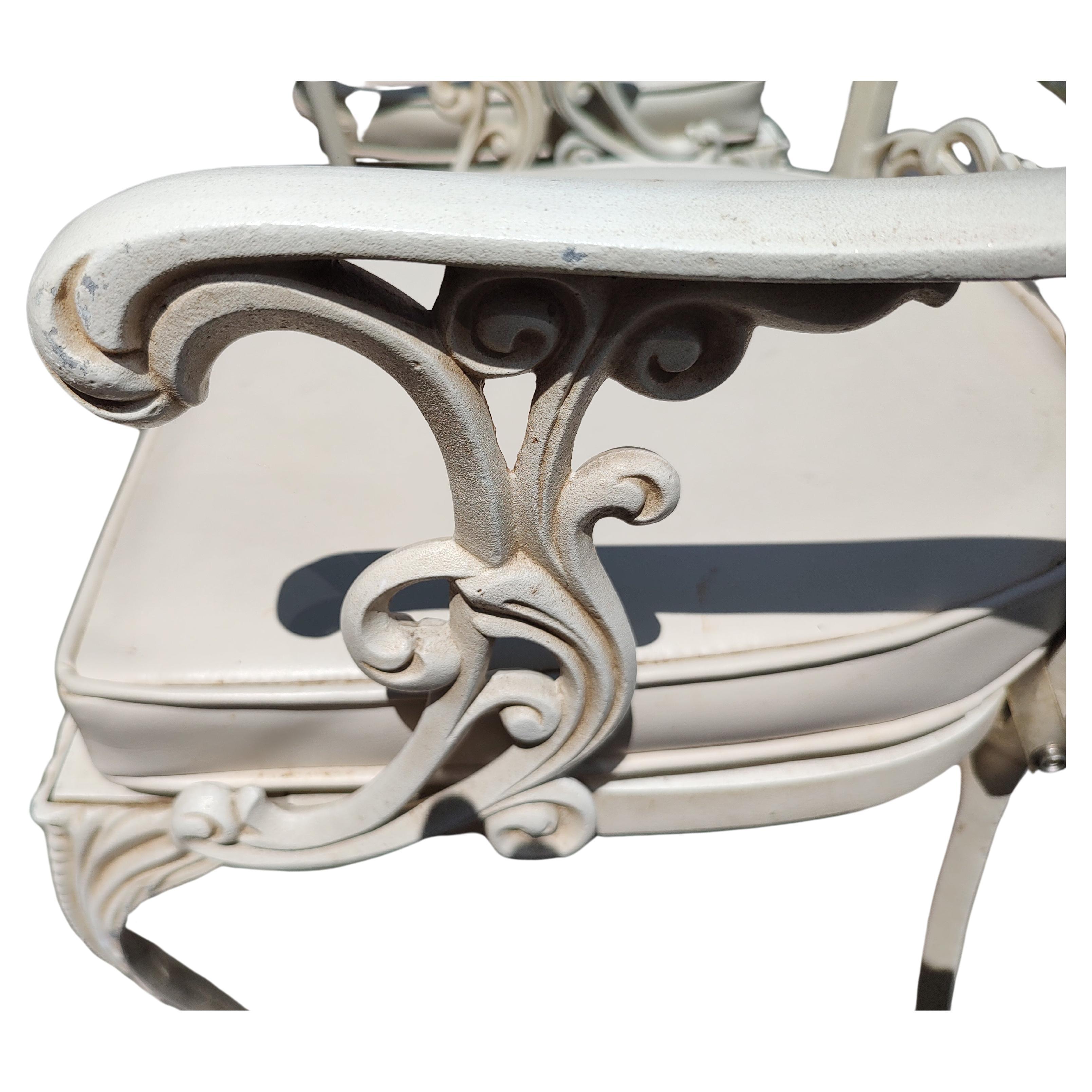 Classic fabulous indoor outdoor patio set in cast aluminum by Molla of Italy. Impeccable castings in aluminum and then powder coated. Ball and claw foot on front legs of the chairs where there is a double casting on the seat backs. All are armchairs