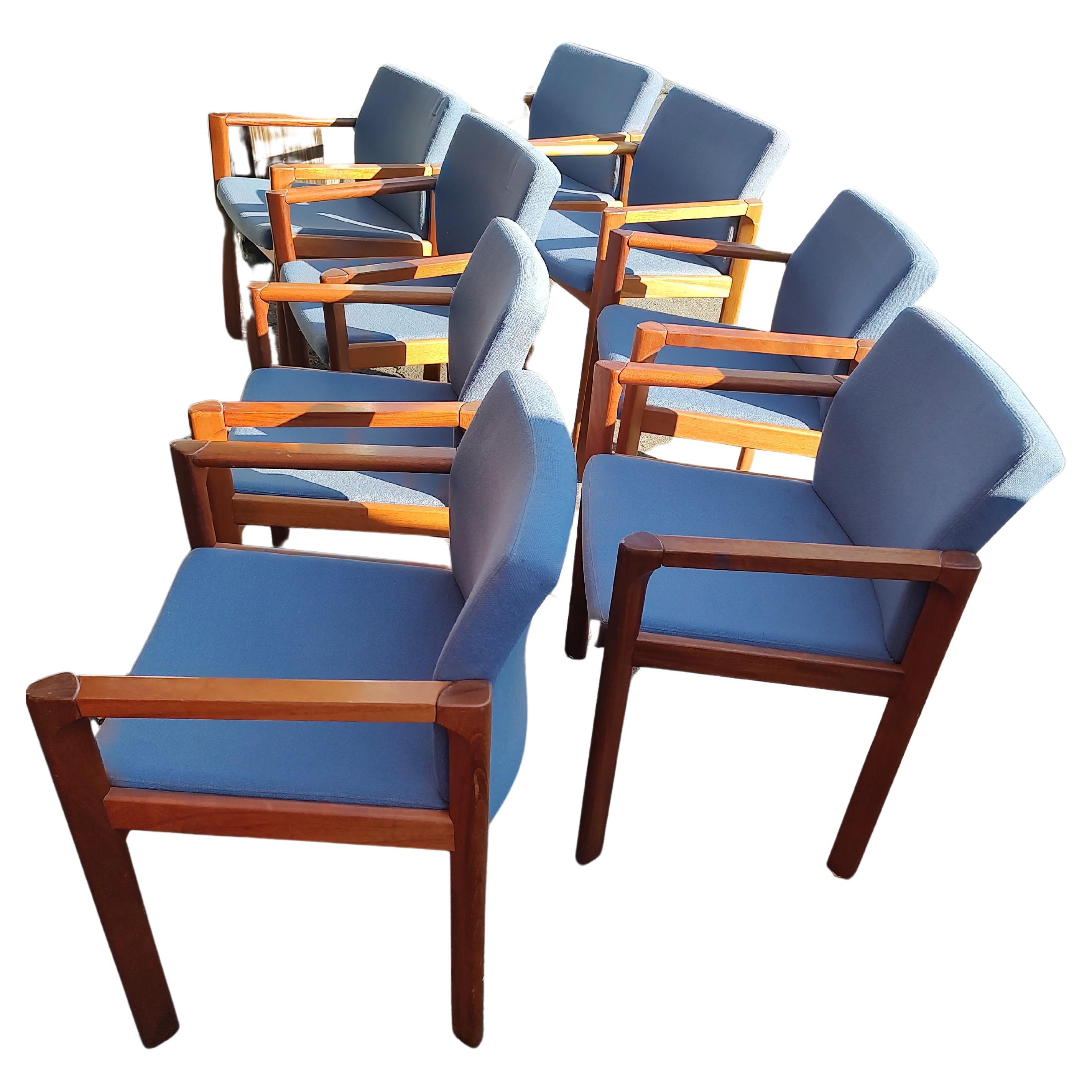 Fantastic set of 8 Danish Modern Dining / conference chairs in mahogany with a Knoll like blue fabric. Simple yet elegant seats appear to be floating from the backside view. Bevelled edge arms squared off with the legs create a unique and