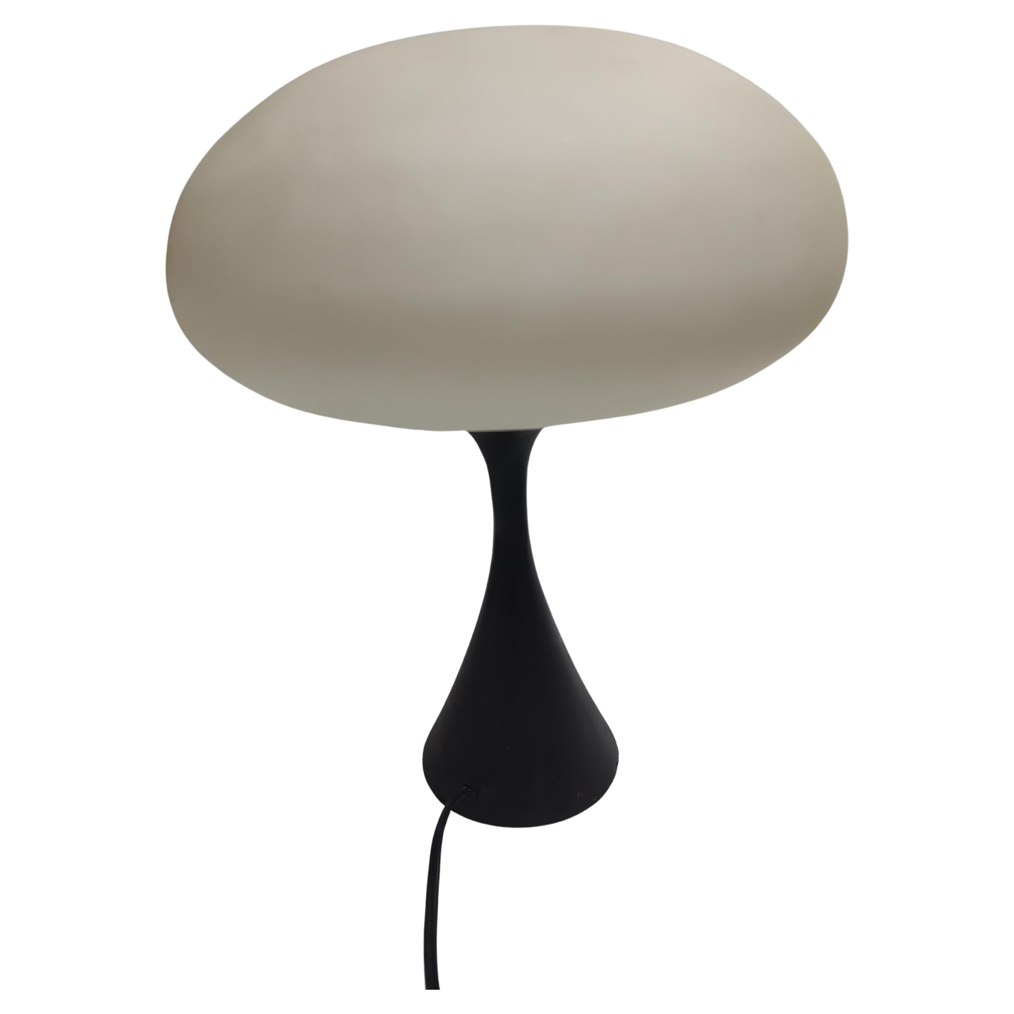 Fabulous mushroom table lamp from the mid sixties with a 3-way switch and inline switch also. Taller version with a heavy cast iron base for stability. Rewired. In excellent vintage condition with minimal wear. We have several other Mushroom shade