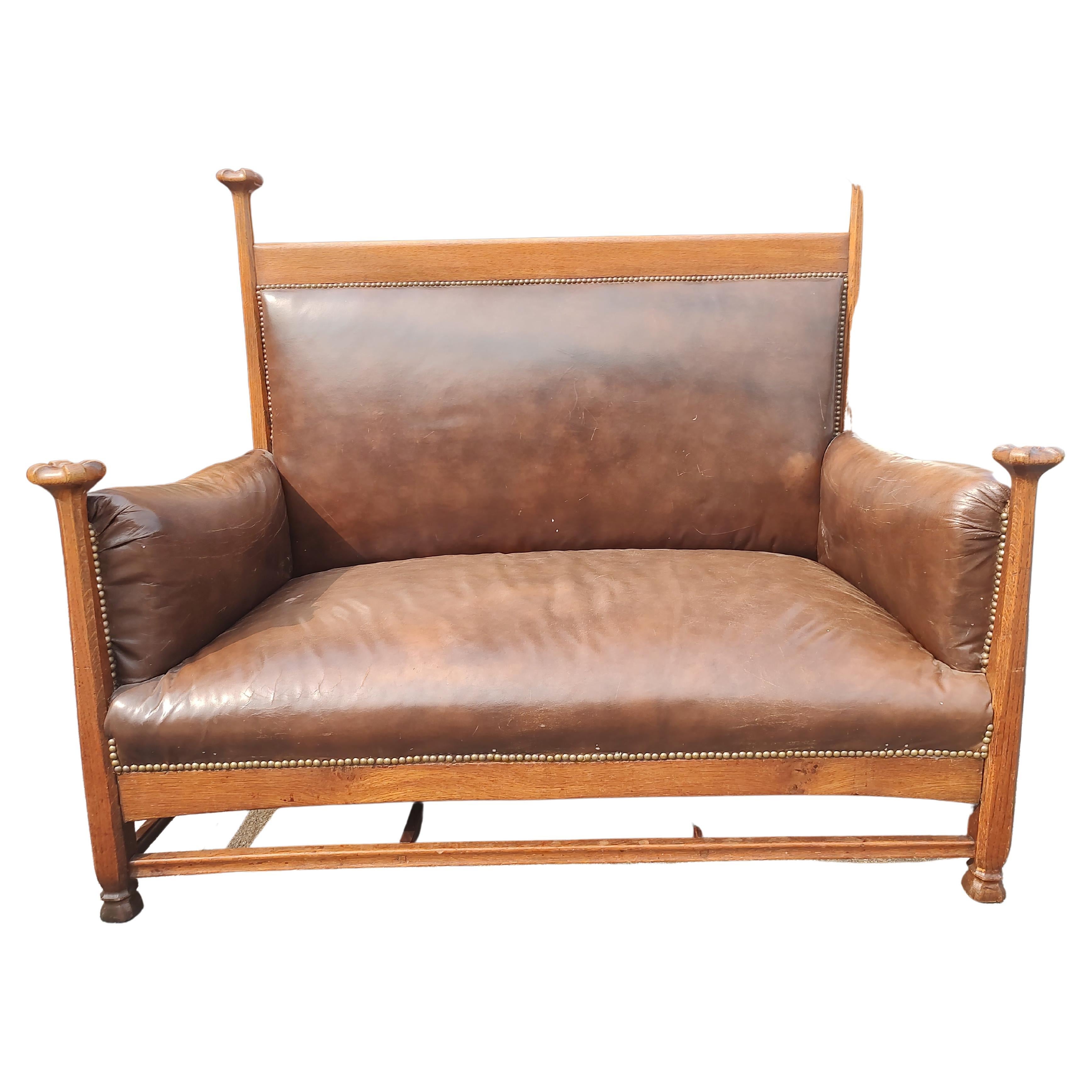 Early 20th Century Scottish Arts & Crafts Leather and Oak Loveseat attributed to Wylie & Lochhead For Sale