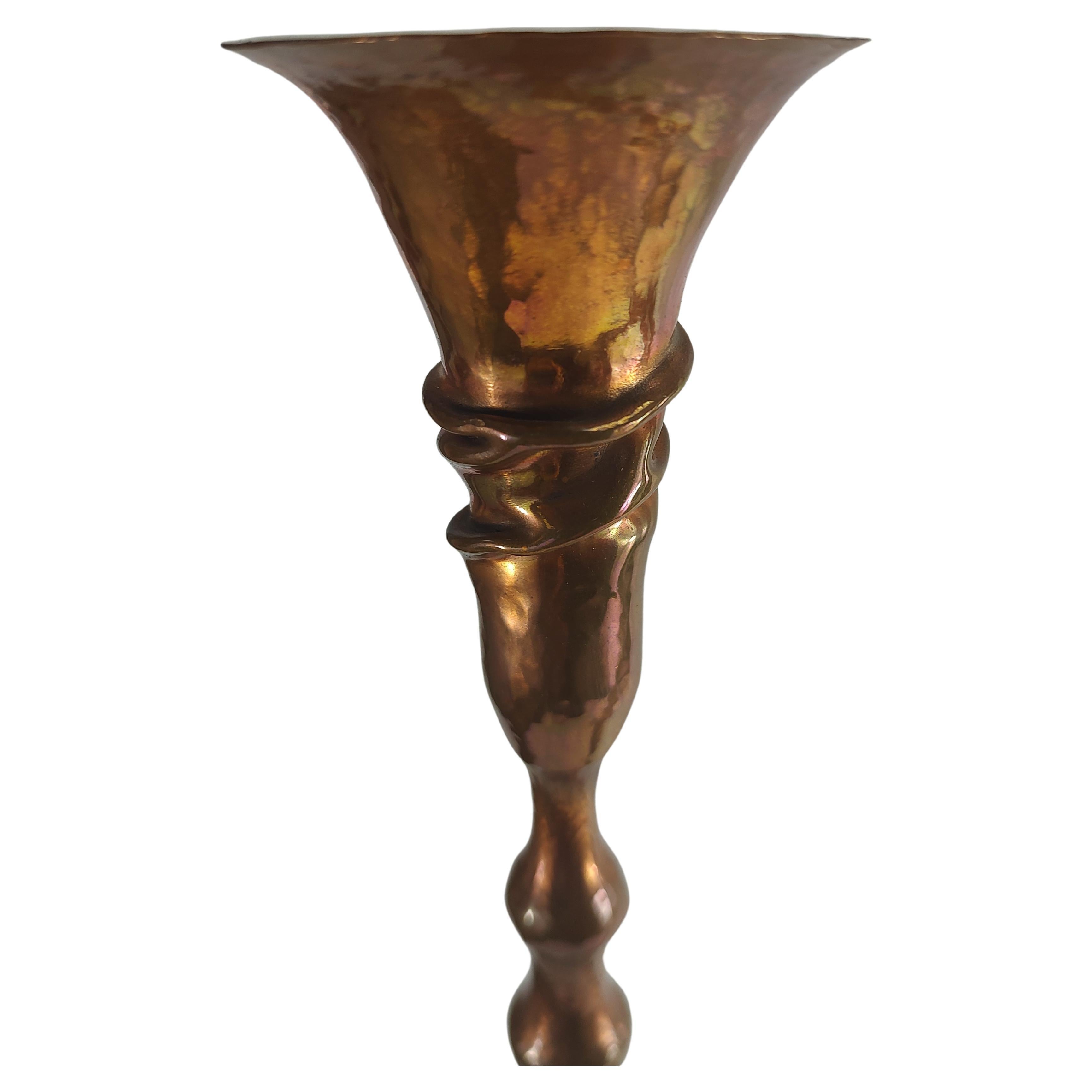 Fabulous simple and elegant arts & crafts style hand hammered copper candlestick holder made by Hessel Studios in San Rafael California. Tall sinewy and well balanced,  These are fine works of art. Priced individually. Tallest is on the right