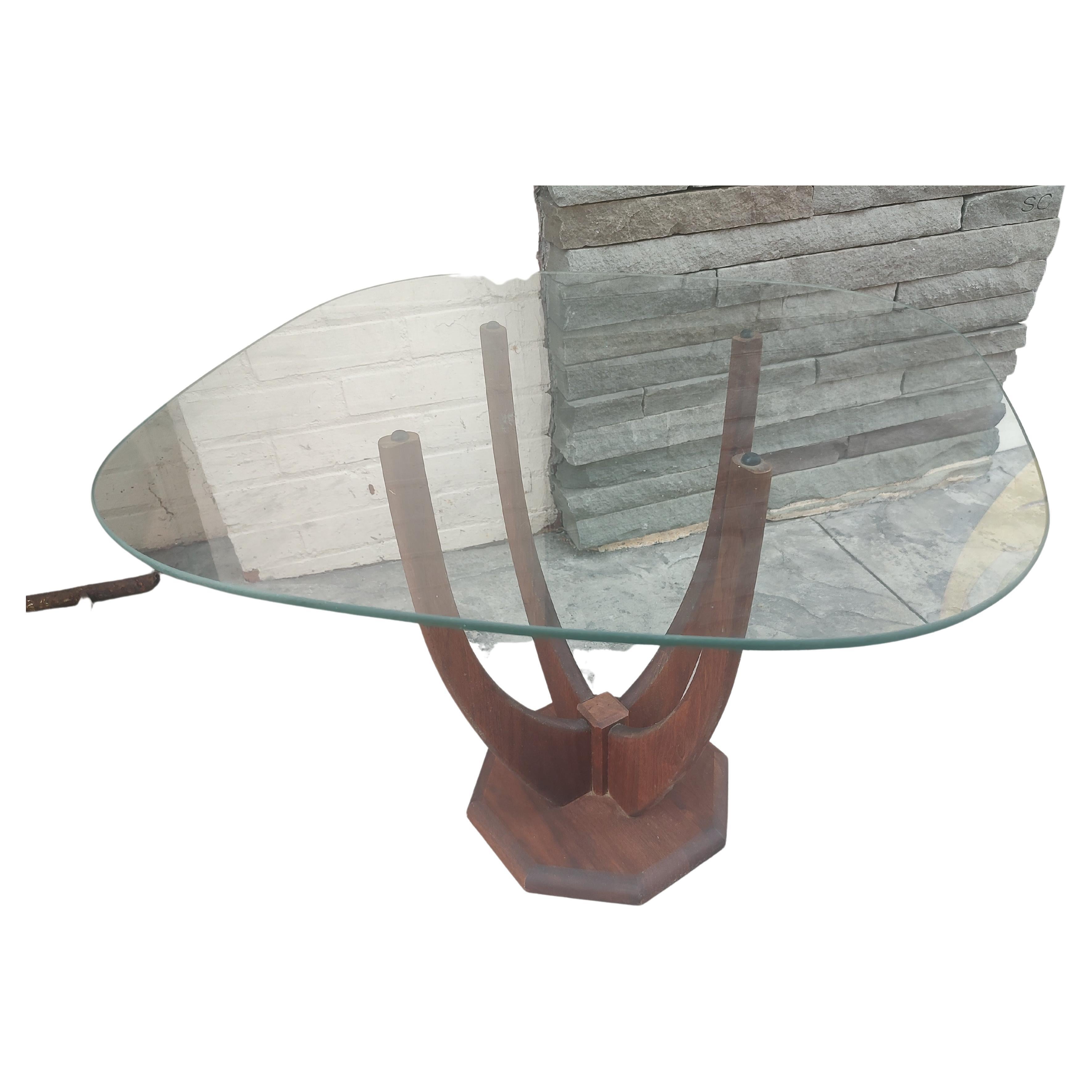 Simple yet rare stylized table by Adrian Pearsall in Walnut with a square piece of glass on top. Base actually looks like it should be reversed but it is correct in shown position. In excellent vintage condition with minimal wear. Glass is perfect.