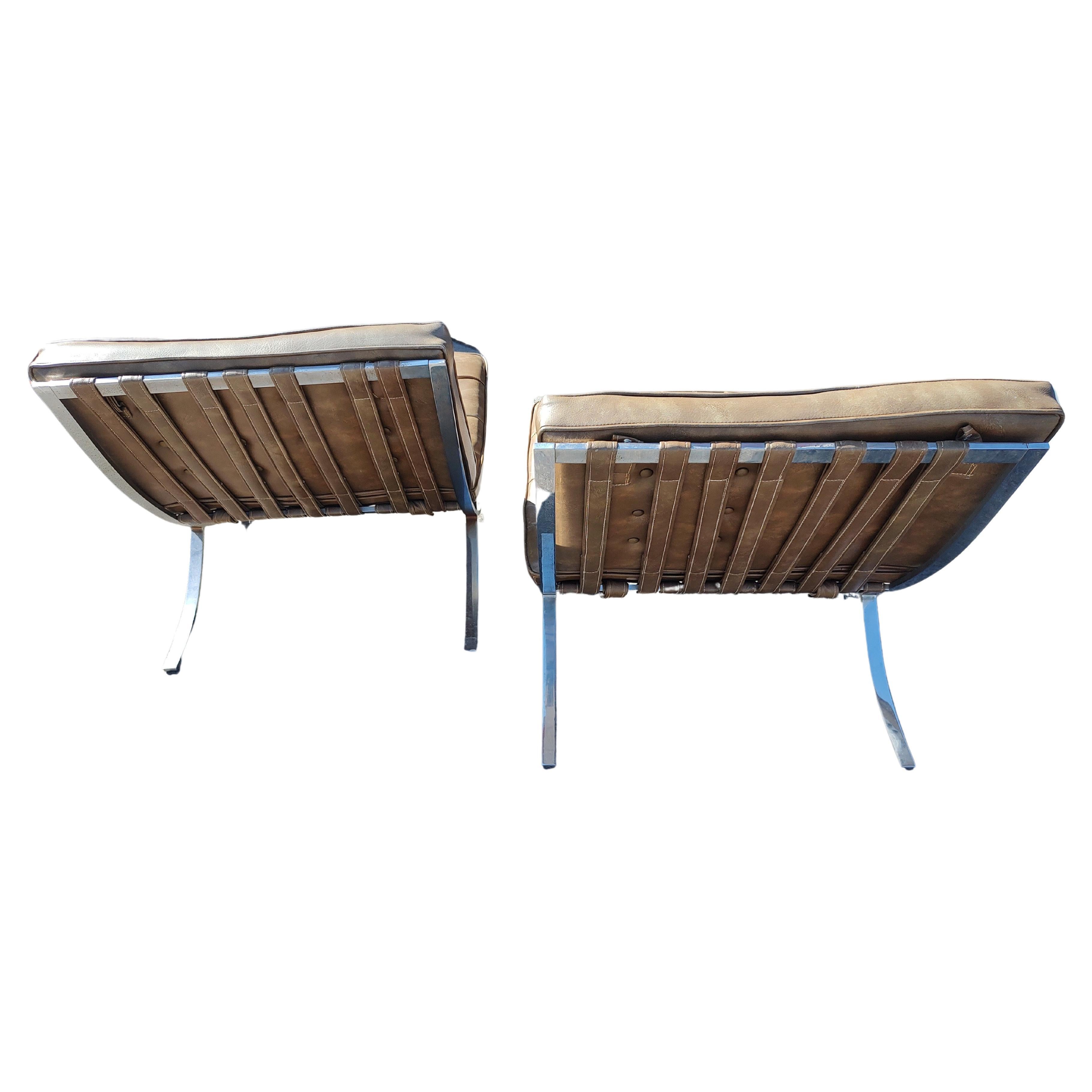 Fabulous pair of Mid Century Modern Sculptural Chairs from the designs of the Bauhaus period by Ludwig Mies van DerRohe c1926. Heavy duty steel with more than adequate chrome plating the frames. Naughahyde straps all intact along with the original