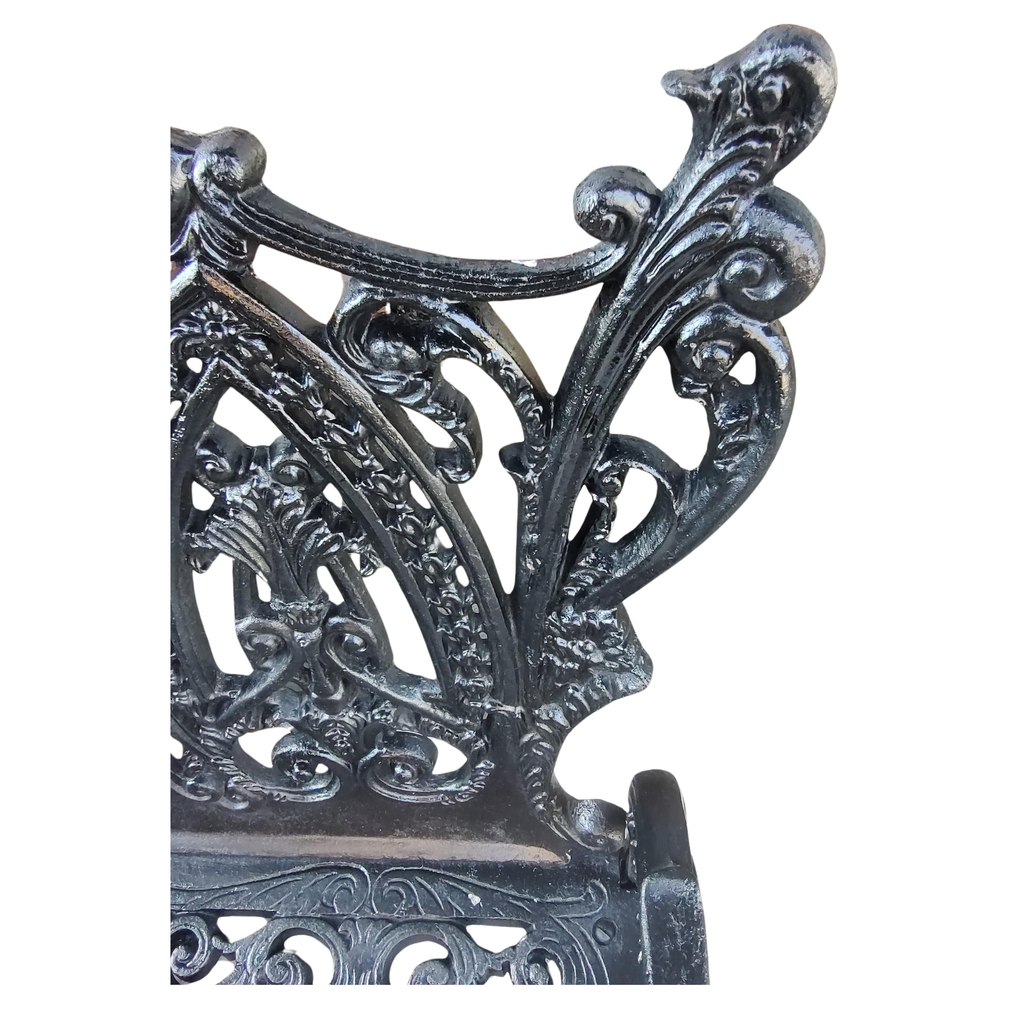 Fabulous and large garden bench in an Art Noveau style with spectacular details in the casting. Extremely ornate. In excellent vintage condition with minimal wear, was freshly painted black.