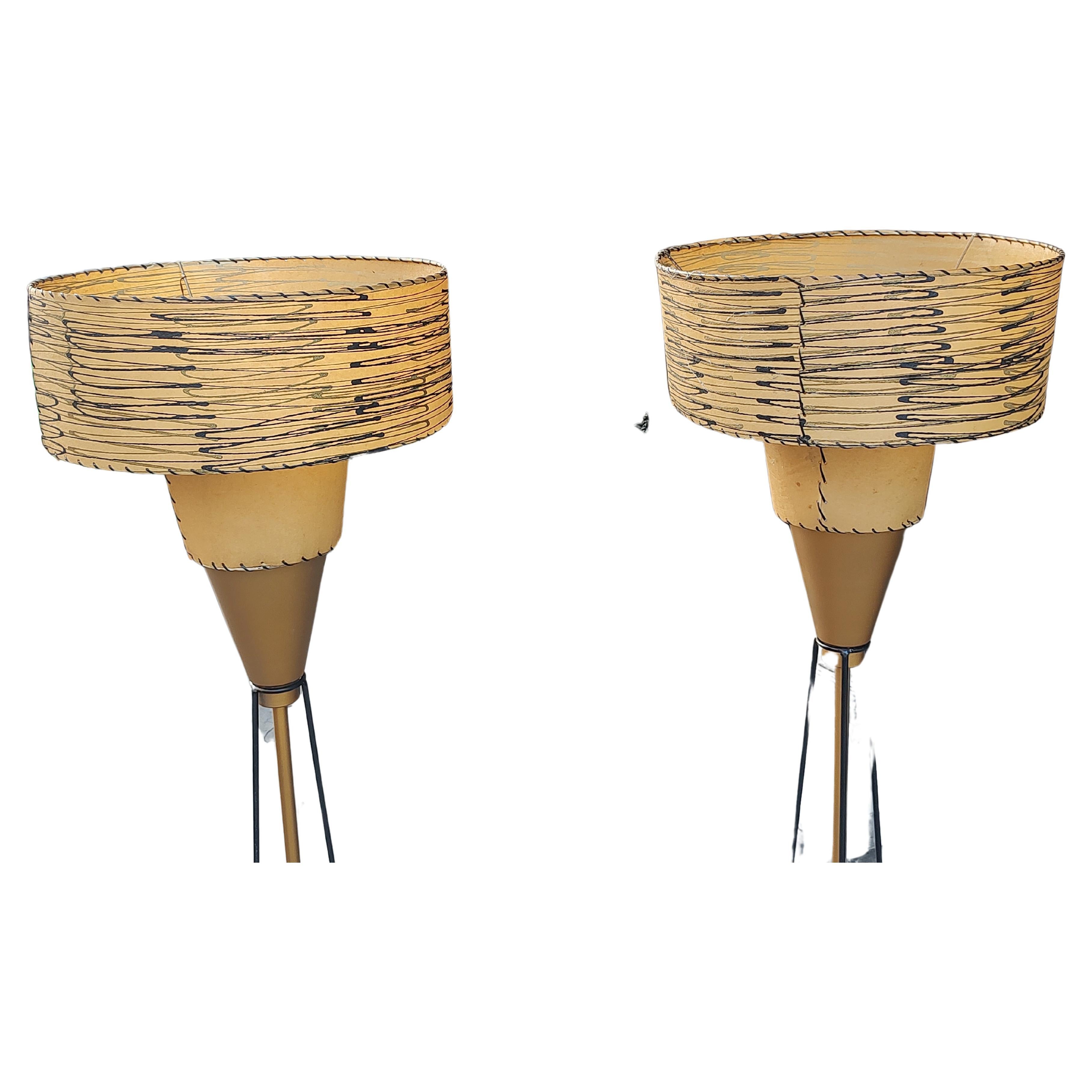 Fabulous and rare pair of Mid Century Modern Sculptural floor lamps attributed to the Majestic Lamp Co.  All original parts with restored bases (painted, rewired). Shades are totally intact and original in all manners.Double shades have a cradle