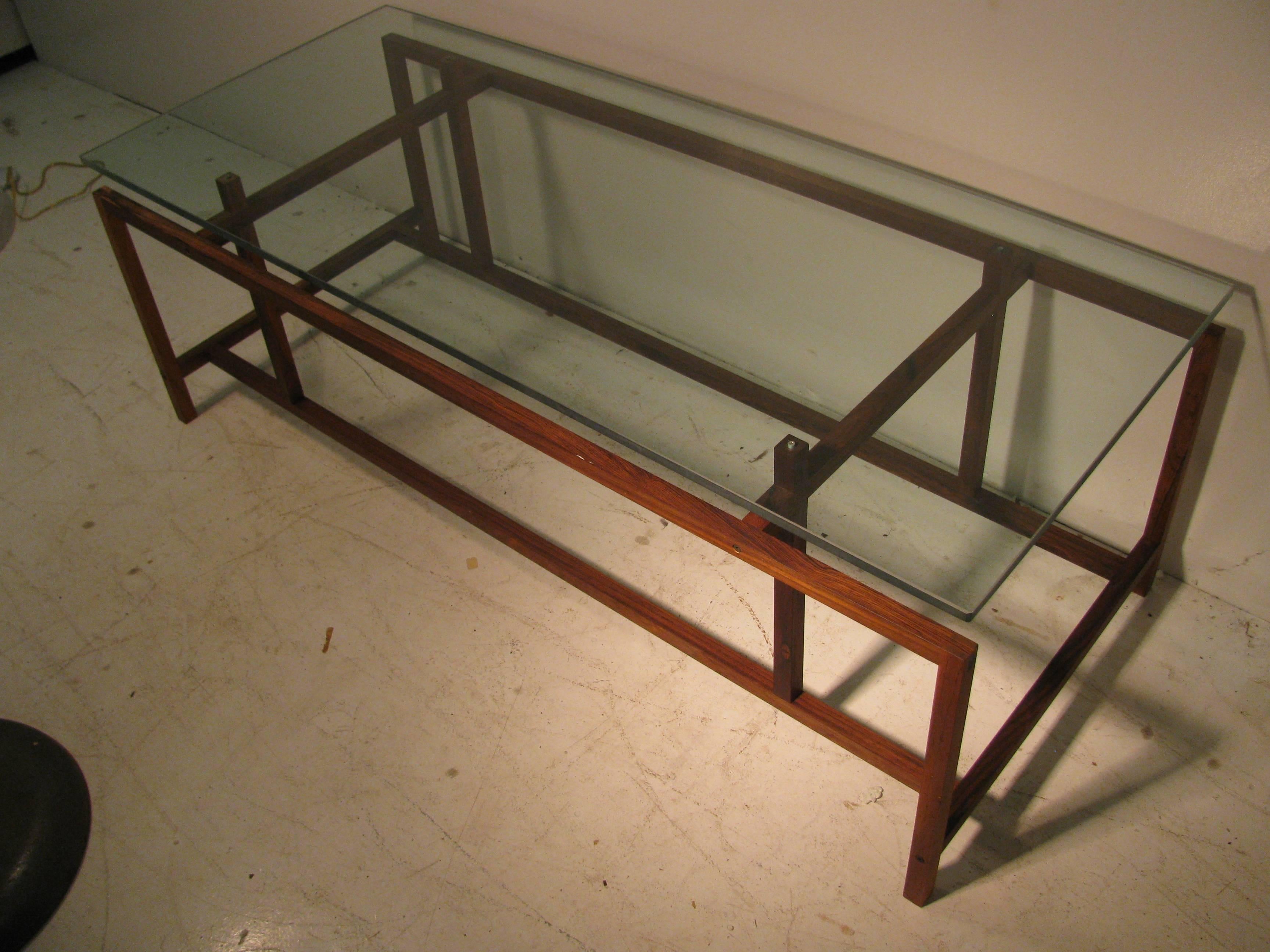 Simple and elegant. Architectural form with glass cantilevered over rosewood frame. Glass fits into wood pins to secure glass to the frame. All inquiries please call or just press “Contact Dealer” button.
