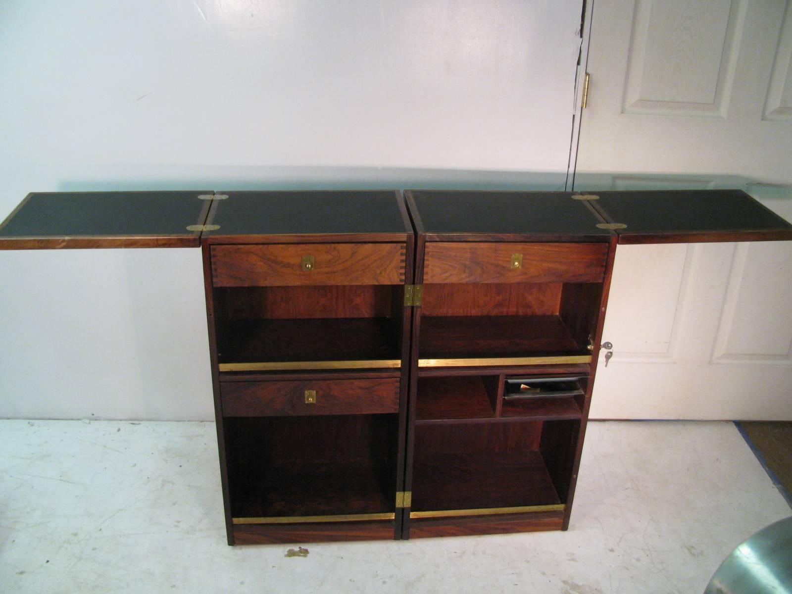 Beautiful, simple and elegant rosewood bar cabinet. Cabinet is well made with dovetailing and has maintained its integrity. Cabinet opens and closes and can be locked to secure goods inside. Has three drawers, 15x 8.25 is the measurement of the