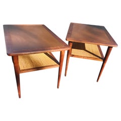 Pair of Mid Century Modern Walnut End Tables with a Caned Shelf