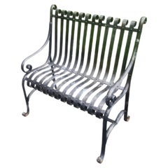Panchina da giardino del XIX secolo con struttura in ferro battuto, verniciata in nero antico
