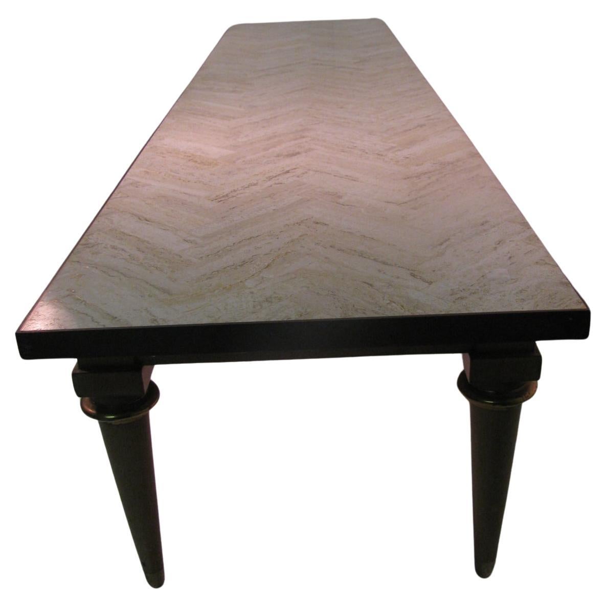 Beautiful simple and elegant. Architecturally styled in its length [75 in.] with a Quilted Herringbone design in the limestone Marble top. Marble top is framed in Bronze. Turned Legs with a Brass ring end with a brass sabot. The wood is Walnut. Most