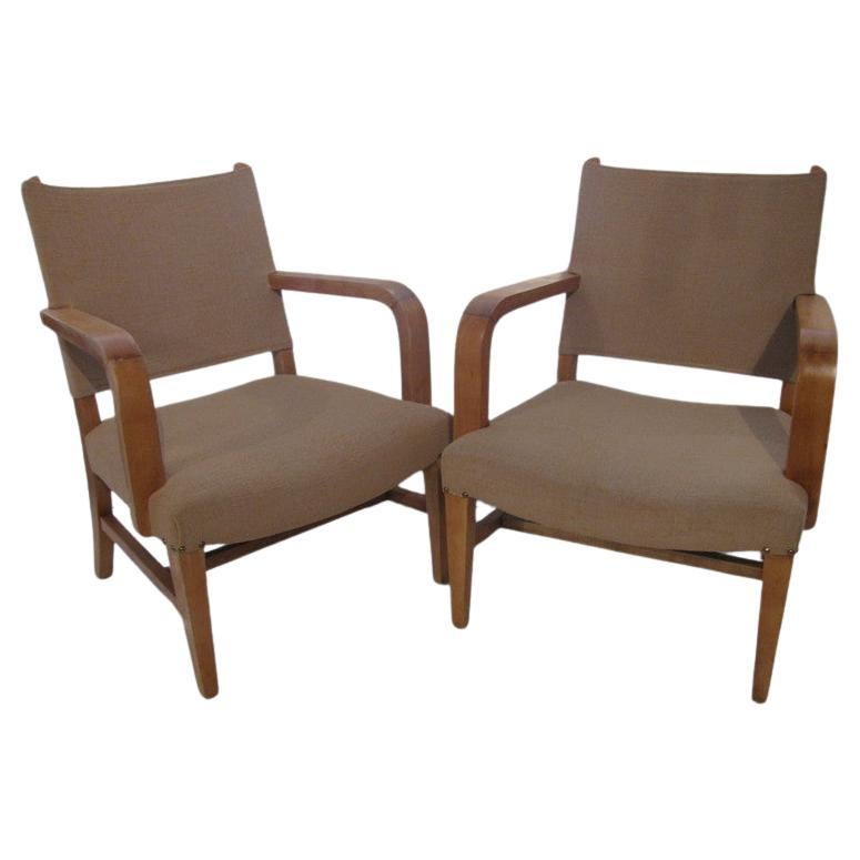 Fabulous Pair of curved bent open arm chairs from the forties. Created from beech, chairs have a clean, simple and elegant pleasing look. Large seats that are very comfortable, recently reupholstered and restored , In excellent vintage condition