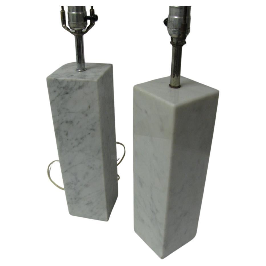 Rectangular Italian marble blocks. Simple, elegant form representative of midcentury Minimalist design. Slight variances in graining and color. Marble lamps have been polished and rewired.