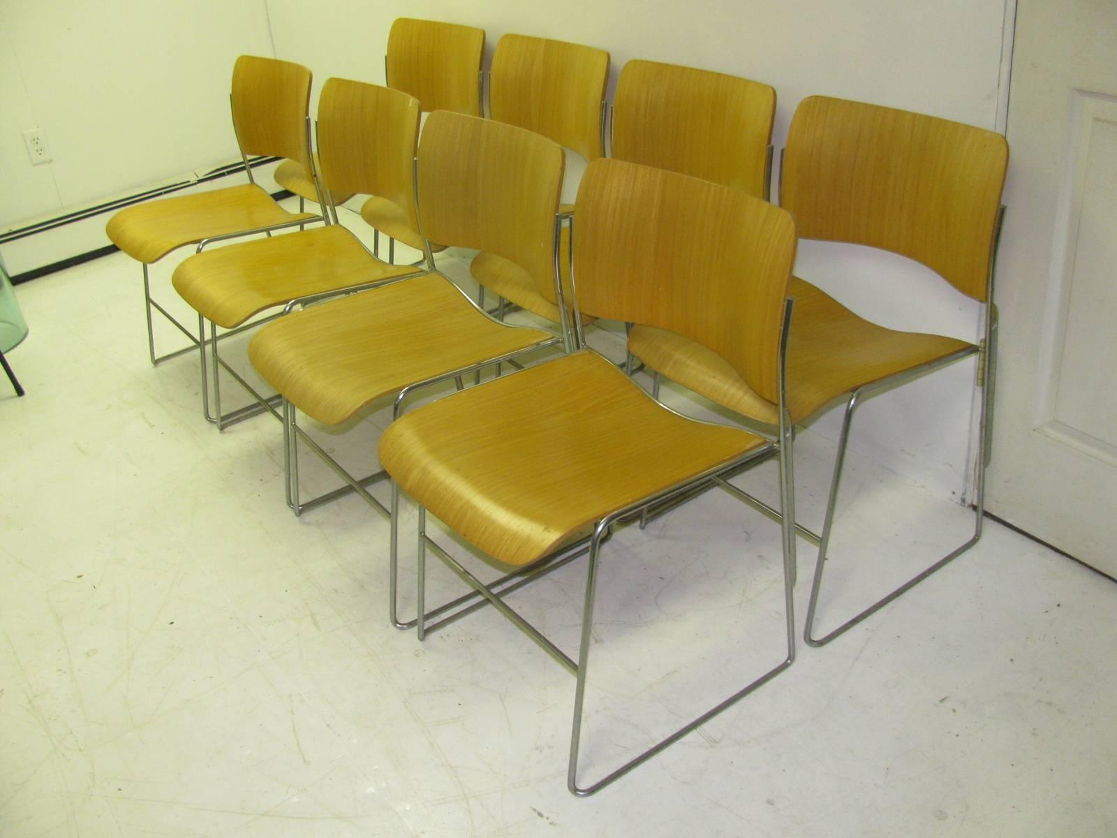 Set of eight 40/4 chairs by David Rowland in bent ply ash. Classic stackable chair which when stacked will fit 40 chairs in just 4 feet of space. Hence the name 40/4 chair. In very good condition with normal wear. Price is for each chair.