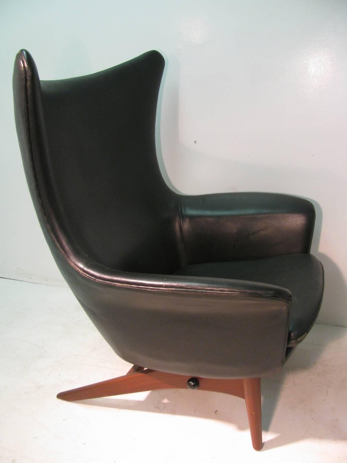 Fabulous five position leather recliner by Bramin for H. W. Klein. Chair with the ottoman supported by a sculpted teak frame. Ottoman size is W 21.75, H 14.5, D 18.