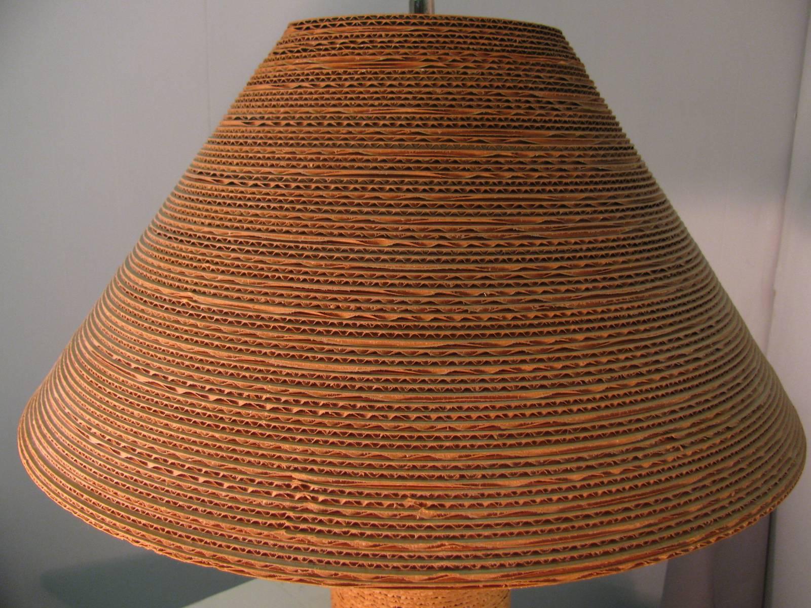 All original cardboard lamp with shade. Wood base. UL listed, 27 in. height is to the top of the shade. Lamp base diameter is 5.25 in.