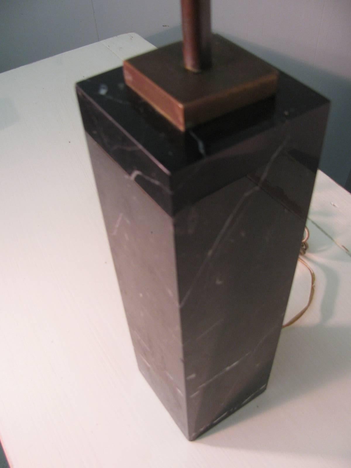 Simple and elegant square block of polished black marble. Marble has great veining. Original brass fittings with double socket for adequate lighting. Designed by T.H. Robsjohn Gibbings for Hansen Lamps N.Y. and was electrified by Beekman Hill