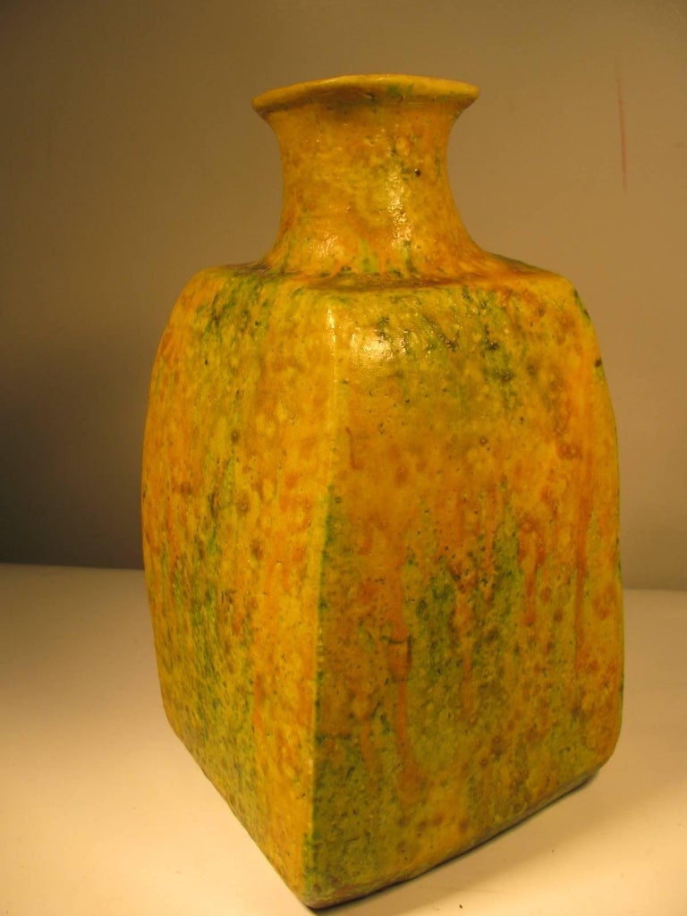 Fantastic coloring in the drip glaze, lively vibrant yellows and greens. Vase is terracotta and approx. 11 inches x 6.25 x 6. In excellent original condition.