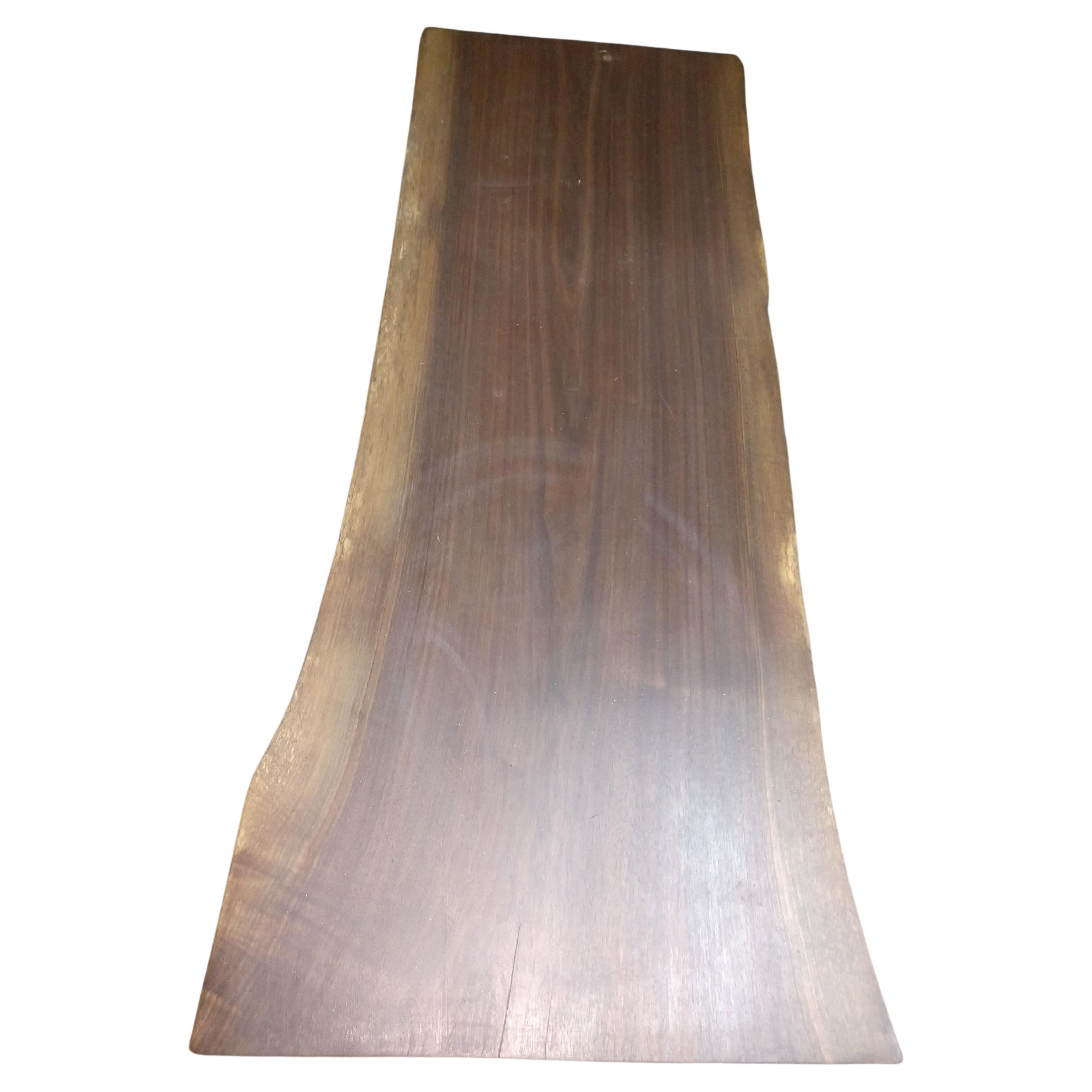 Beautiful and unique. Black walnut top which sits on 2 inch tapered cement slabs that are connected by a heavy iron stretcher. Fabulous 2 inch thick black walnut top cut from a local Hudson valley tree. In excellent condition.  Very Heavy and can