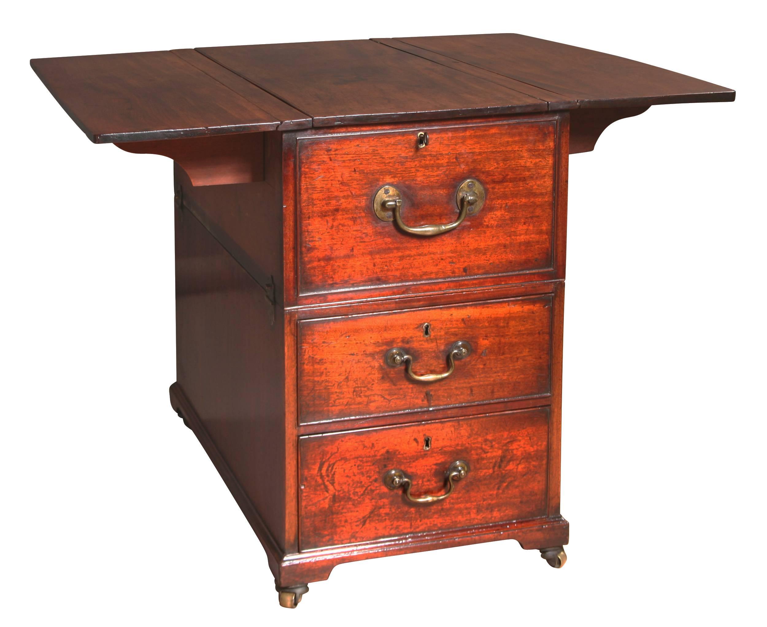 This Georgian, mahogany Cabin or Map Table is unlike any other we have seen before. Like a campaign chest it is made in two parts with the top section fixing to the bottom by two brass twist locks to either side. Typically, Cabin Tables have a
