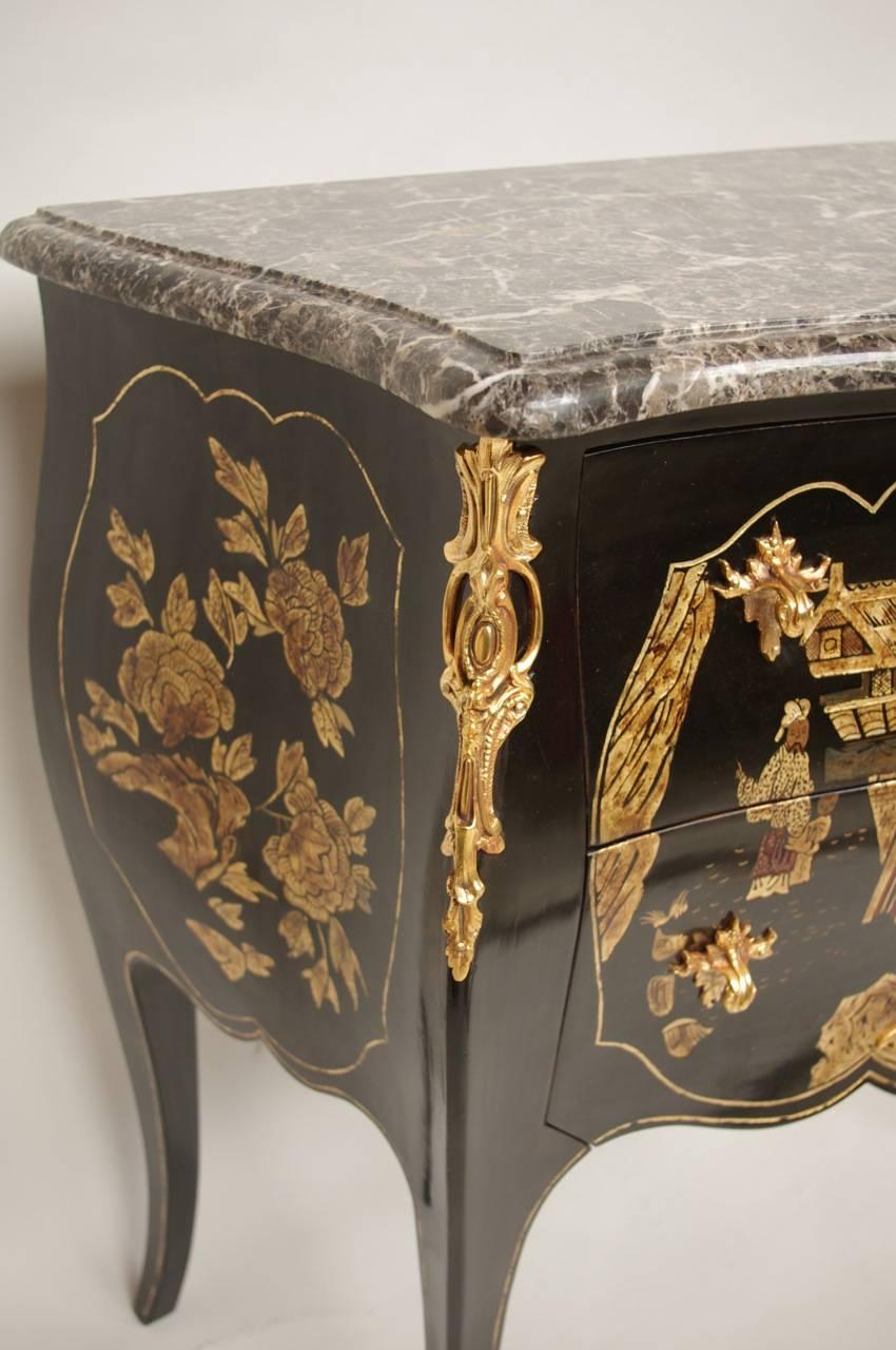 Louis XV style.
Gilt bronze.
Chinese lacquer décor.
1920 period.
Sainte-Anne grey marble top.
Opening on two drawers.