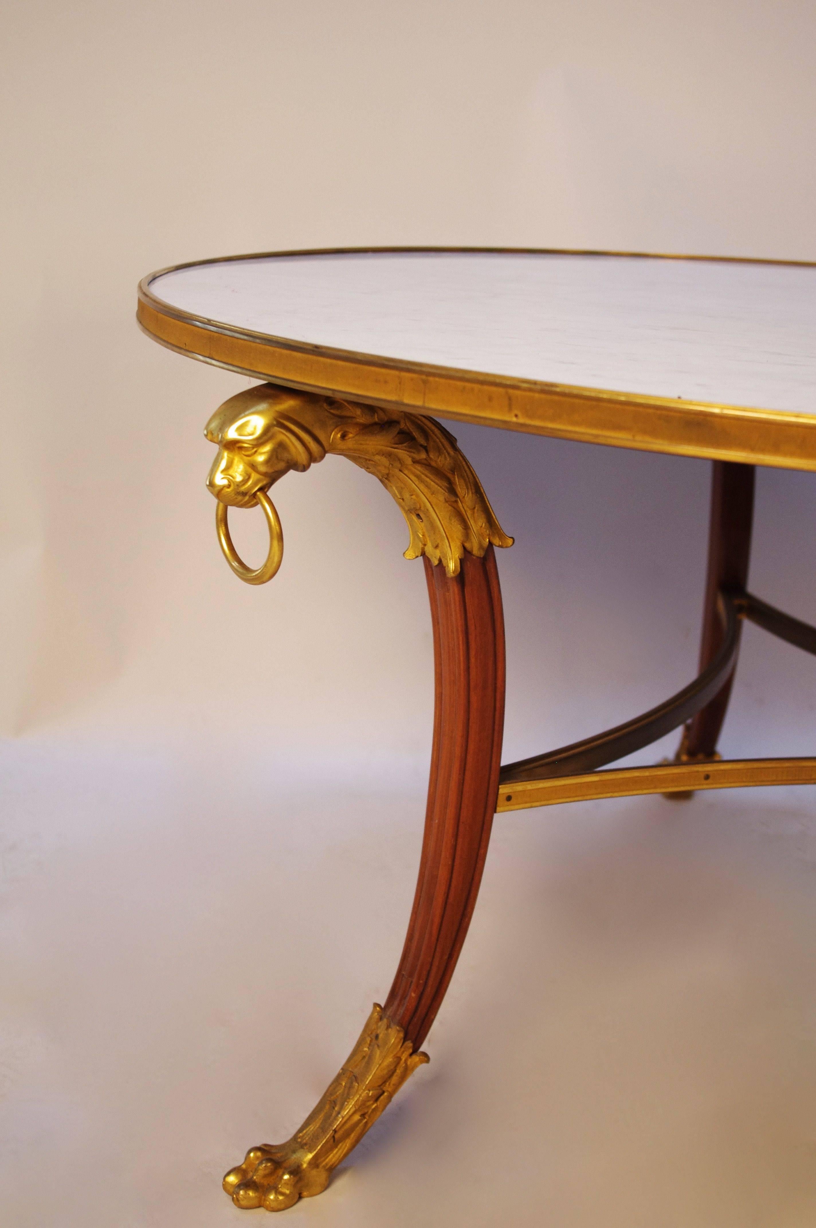 Maison Rinck.
Stamped.
Gilt bronze.
Empire style.
Tripode base in wood and gilt bronze.
Work from 1950.
White carrare marble top.
