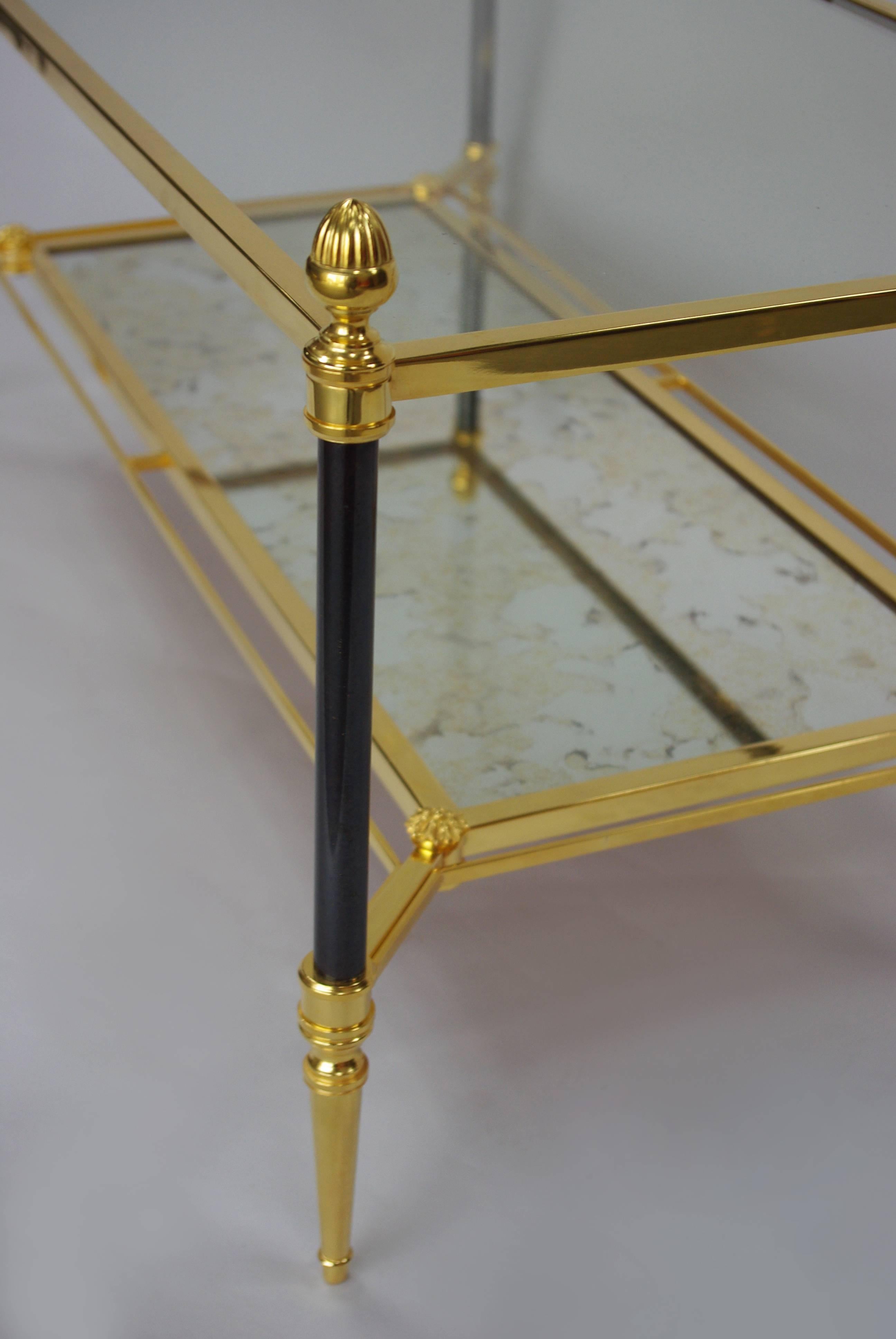 Work from 1960,
Maison Jansen,
Louis XVI style.
Glass top.
Oxidized mirror top, one is darker than the other one (we can have the same oxidized mirror top if required)
2 patinas : Gilt and patinated "canon de fusil".