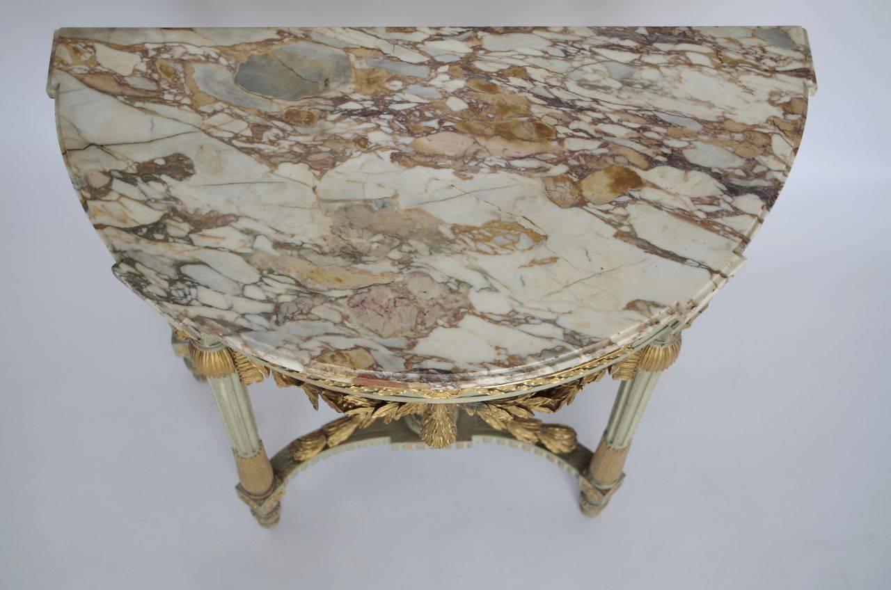 Half-moon and four feet console
Molded and carved wood
Gilt and green celadon color painted wood
Marble-top
French work (signed Mercier Frères on the back)
Late 19th century.
           