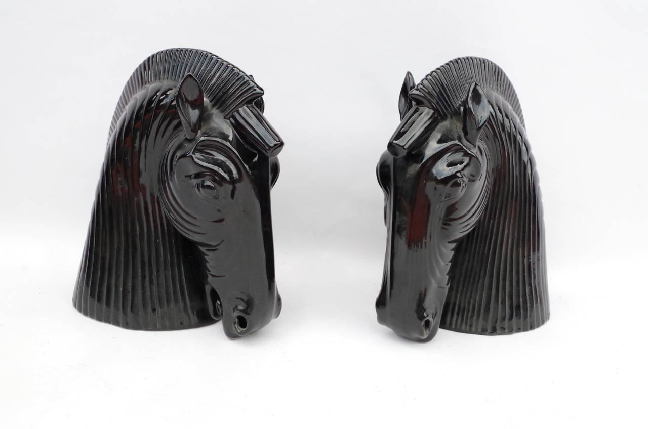 - Pair of black ceramic horse head,
- circa 1970.