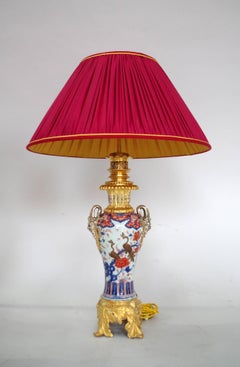 Large pair of Imari porcelain with peacocks lamps, 19th century