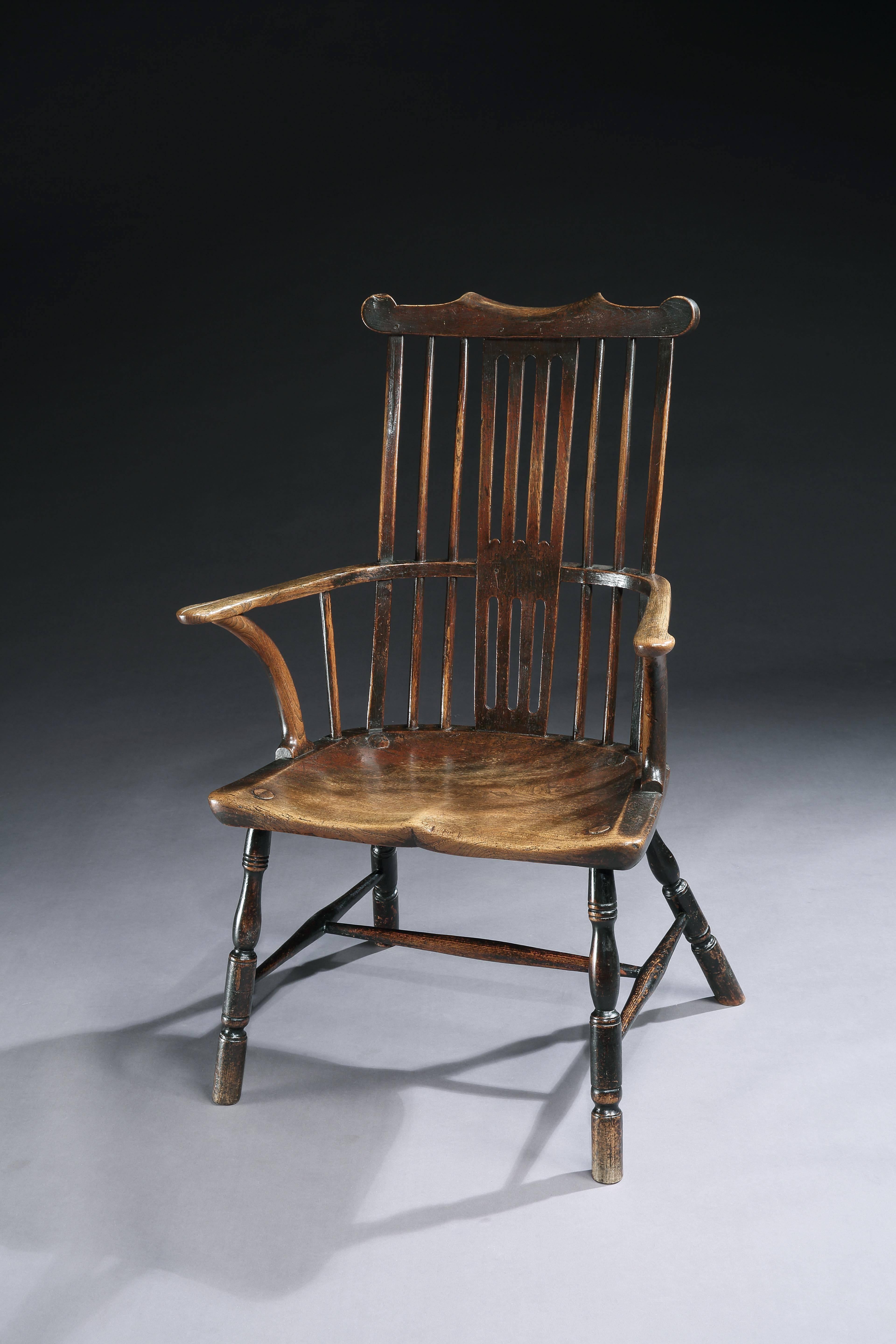 With boldly shaped cresting, well drawn splat and wide saddled seat
elm and ash with rich nutty color and lustrous, 
English, circa 1760.
Measures: 42” high x 28” wide x 18” deep.

Early Georgian splat back and scrolled cresting above a simple