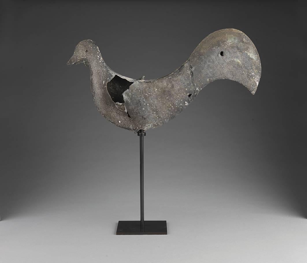 Weathervane of full bodied form with arched tail.
Weathered and patinated zinc,
Northern European.