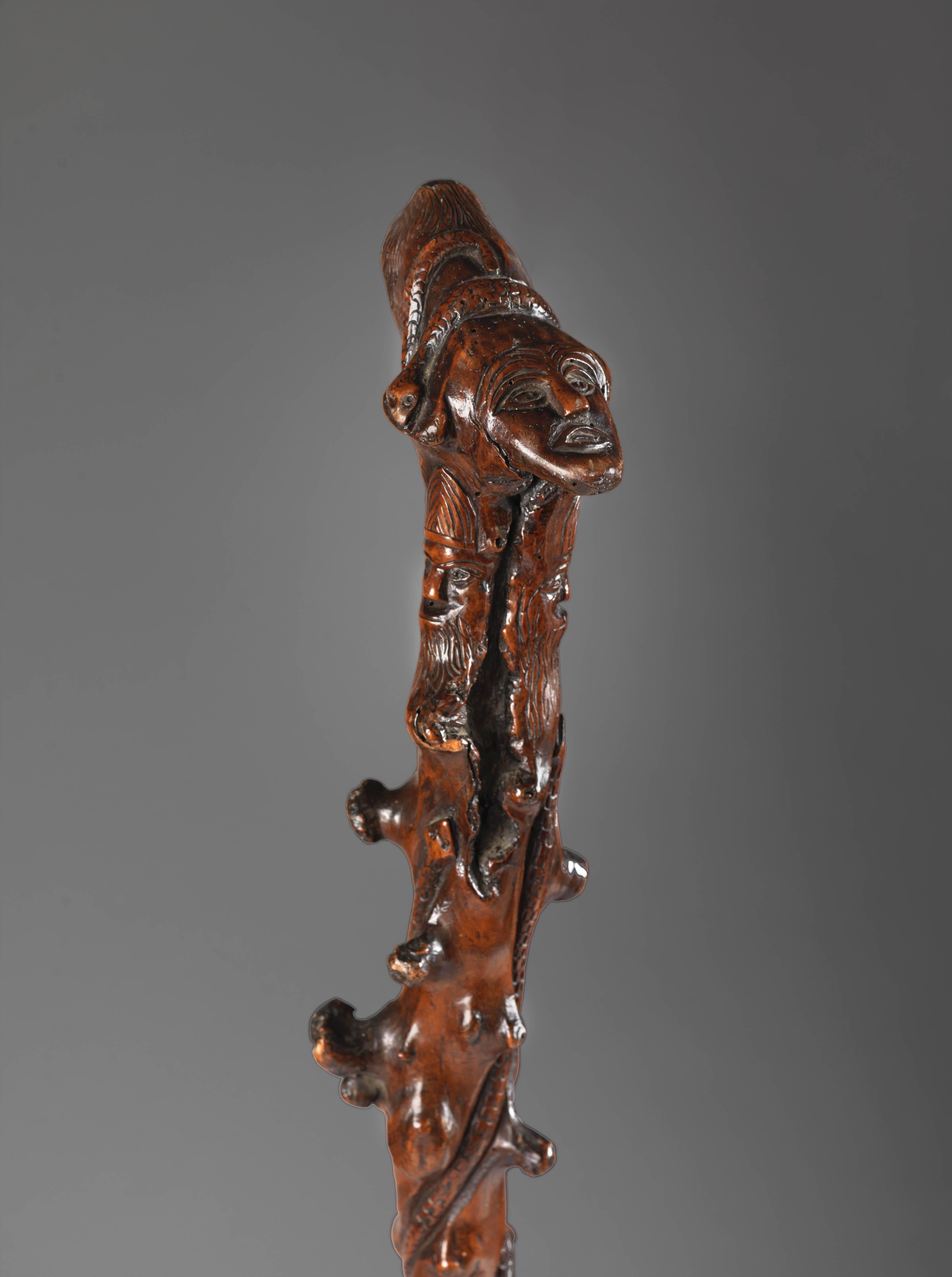 With detailed carved figures and motifs to the shaft and a carved head,
carved solid yew wood,
Irish, circa 1840.
Measure: 36.5
