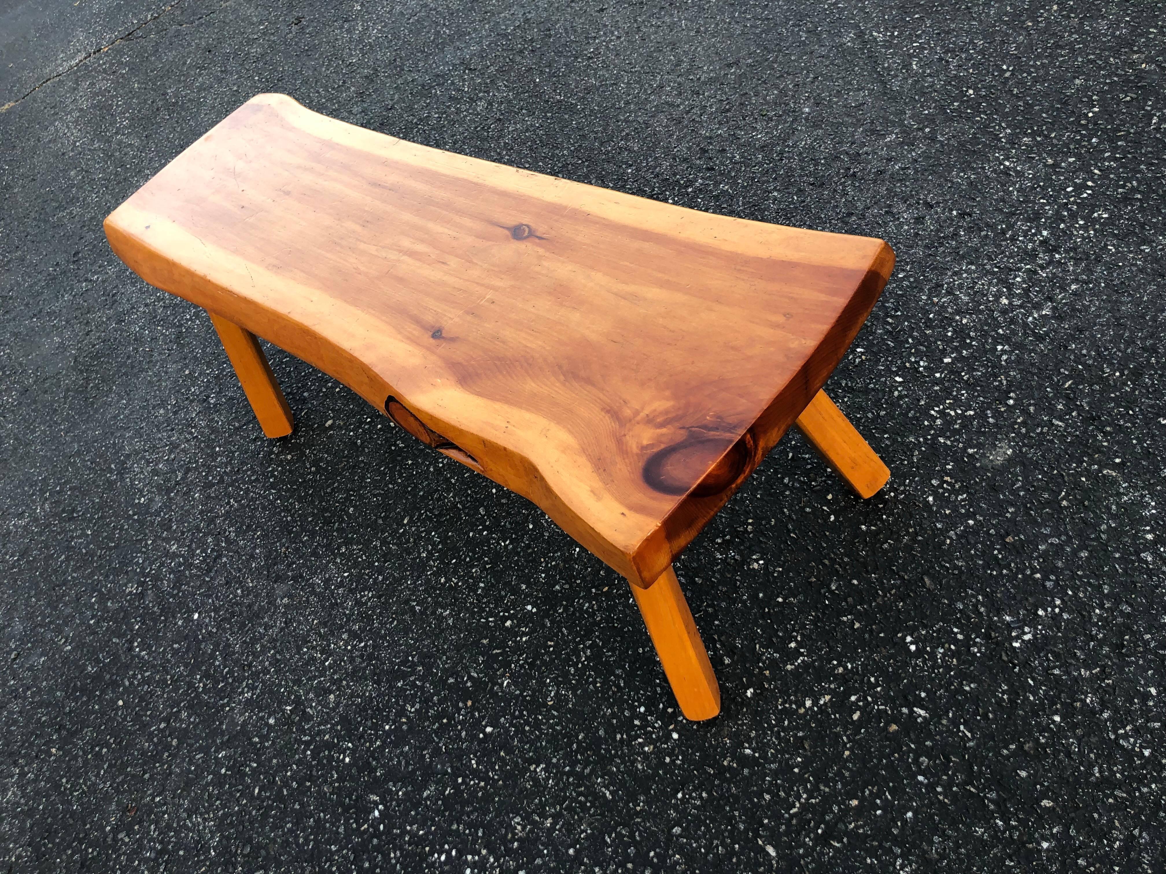 Live edge wooden slab bench or table.
