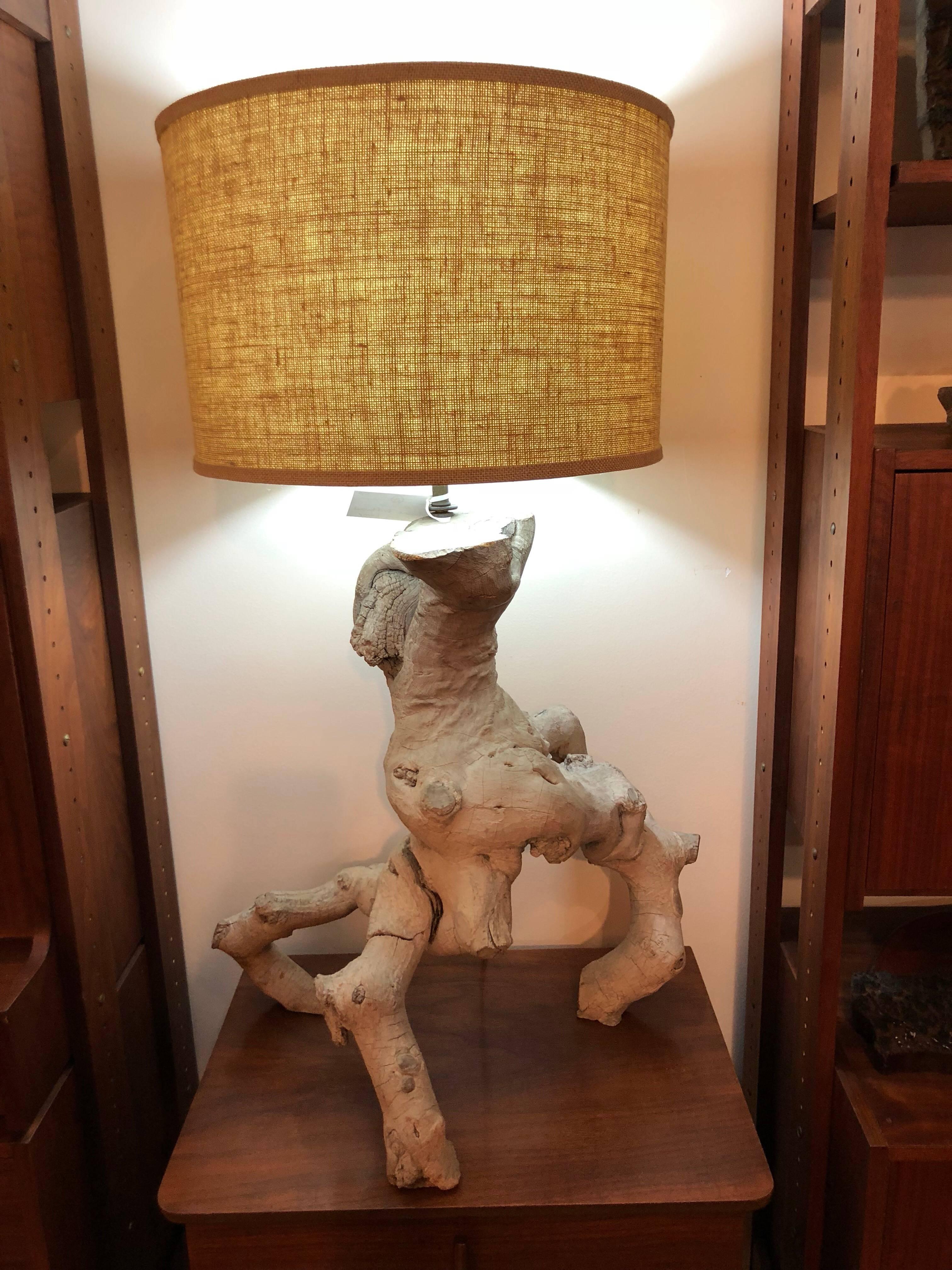 Mid-Century Modern driftwood lamp with original burlap drum shade. Excellent condition. Has one natural seam in it. Is not a crack. This item can parcel ship domestically for $69 