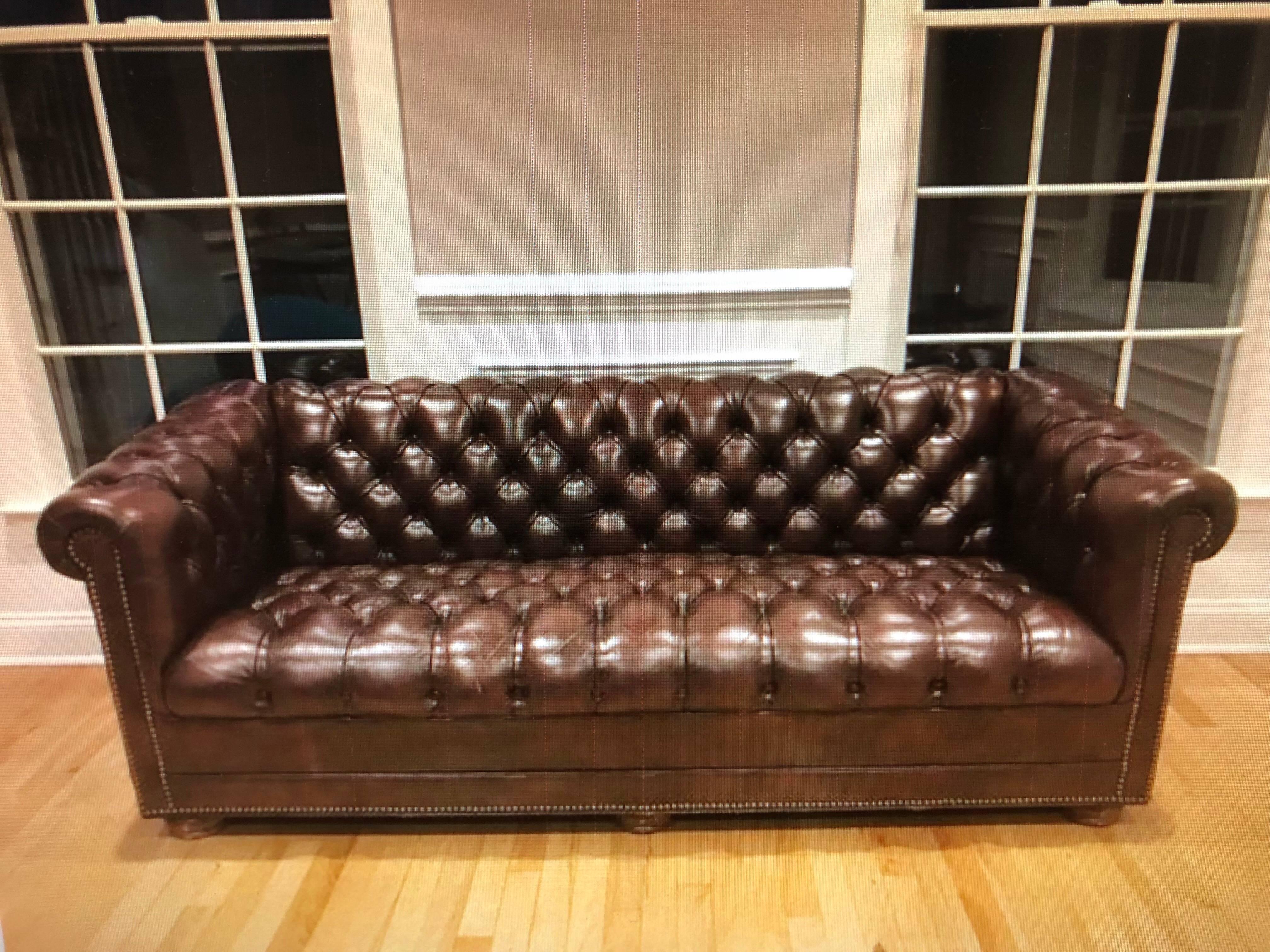 Brown tufted leather Chesterfield sofa. Classic elegant and stylish. This sofa would look great in a study, library , office or living room.