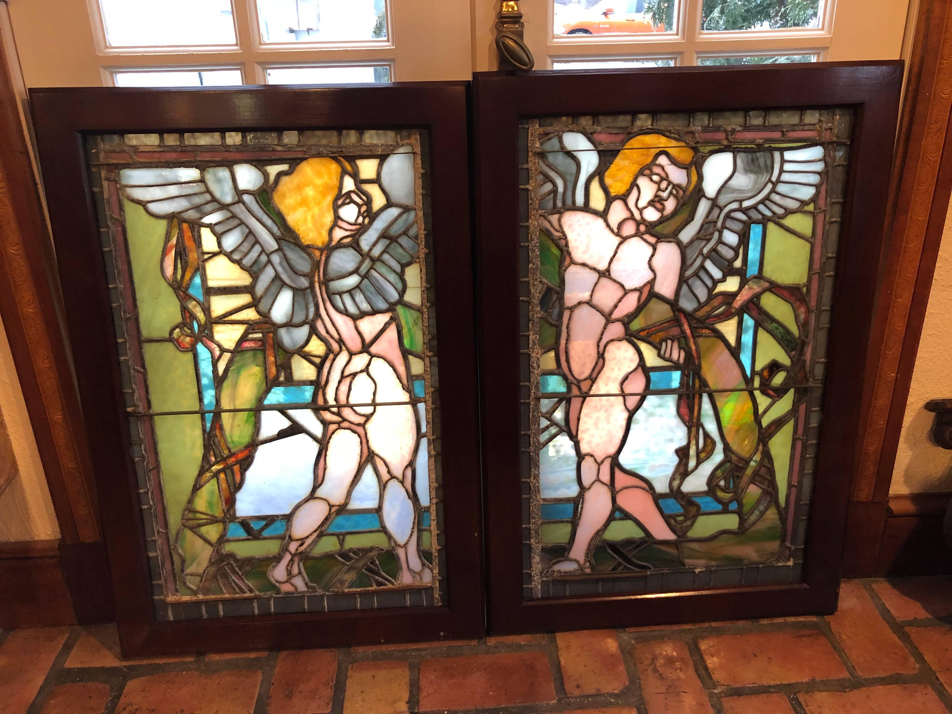 Pair of Antique Stained Glass Windows of Angels in Mahogany Frames. amazing detail and color. Some small hairlines in glass. Please request more close up photos. Price is for the pair of windows,  (two in a pair @ $3200 for both). Could be mounted