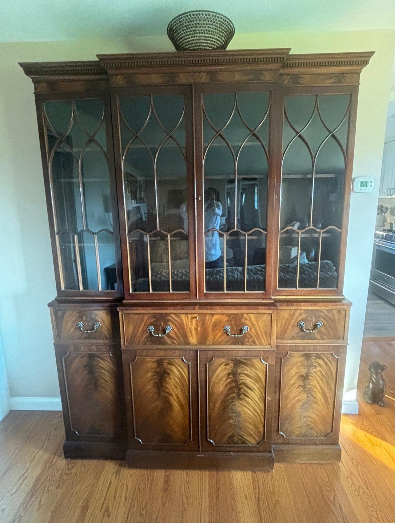 Georgian Flambeau Mahogany Breakfront by Frederick Tibbenham Ltd of Ipswich England.
This classic China cabinet piece will hold all of your family's collection. Its amazing amount of storage makes this an ideal piece for entertaining. You can easily