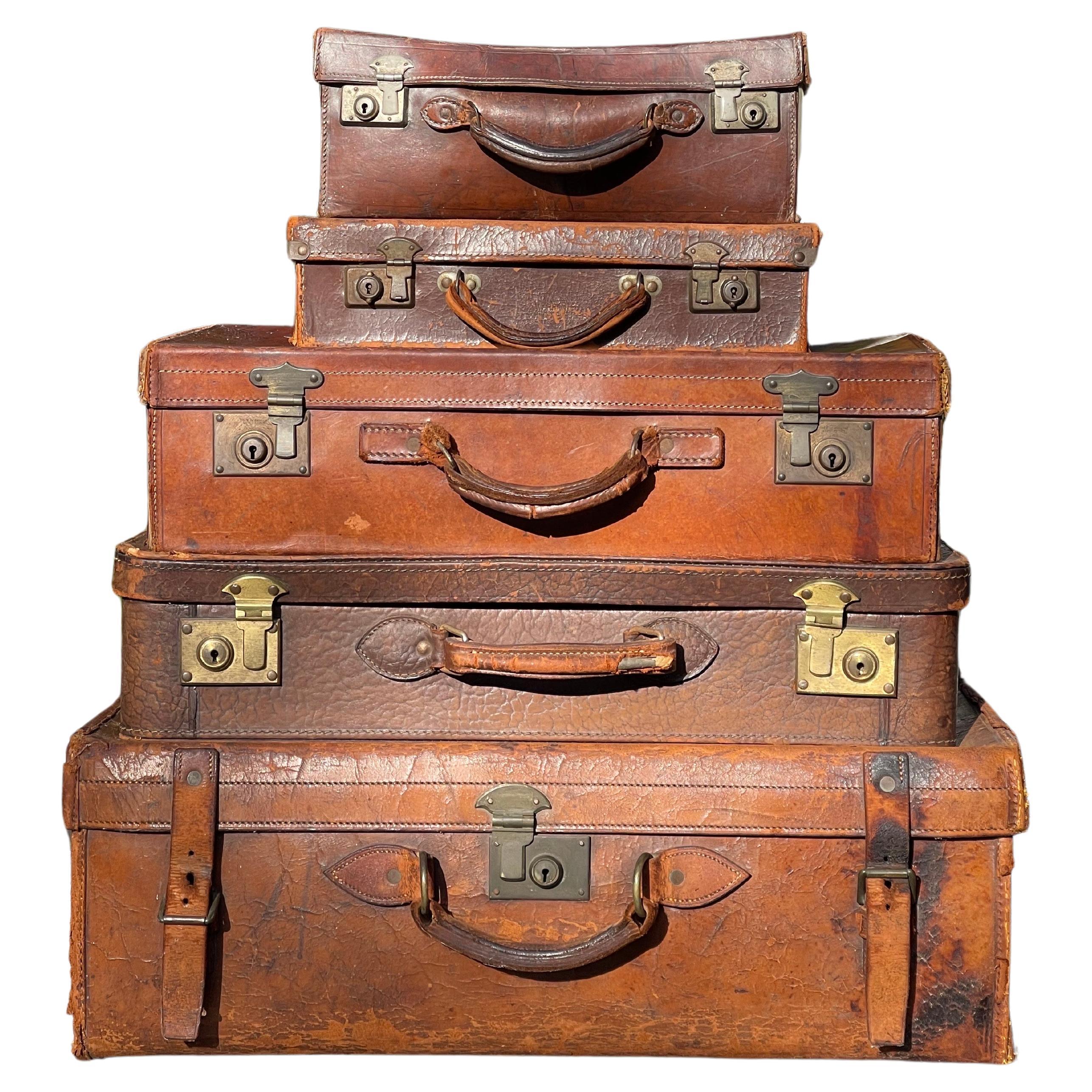 Stacked Set of Five Antique Leather Suitcases or Trunks For Sale