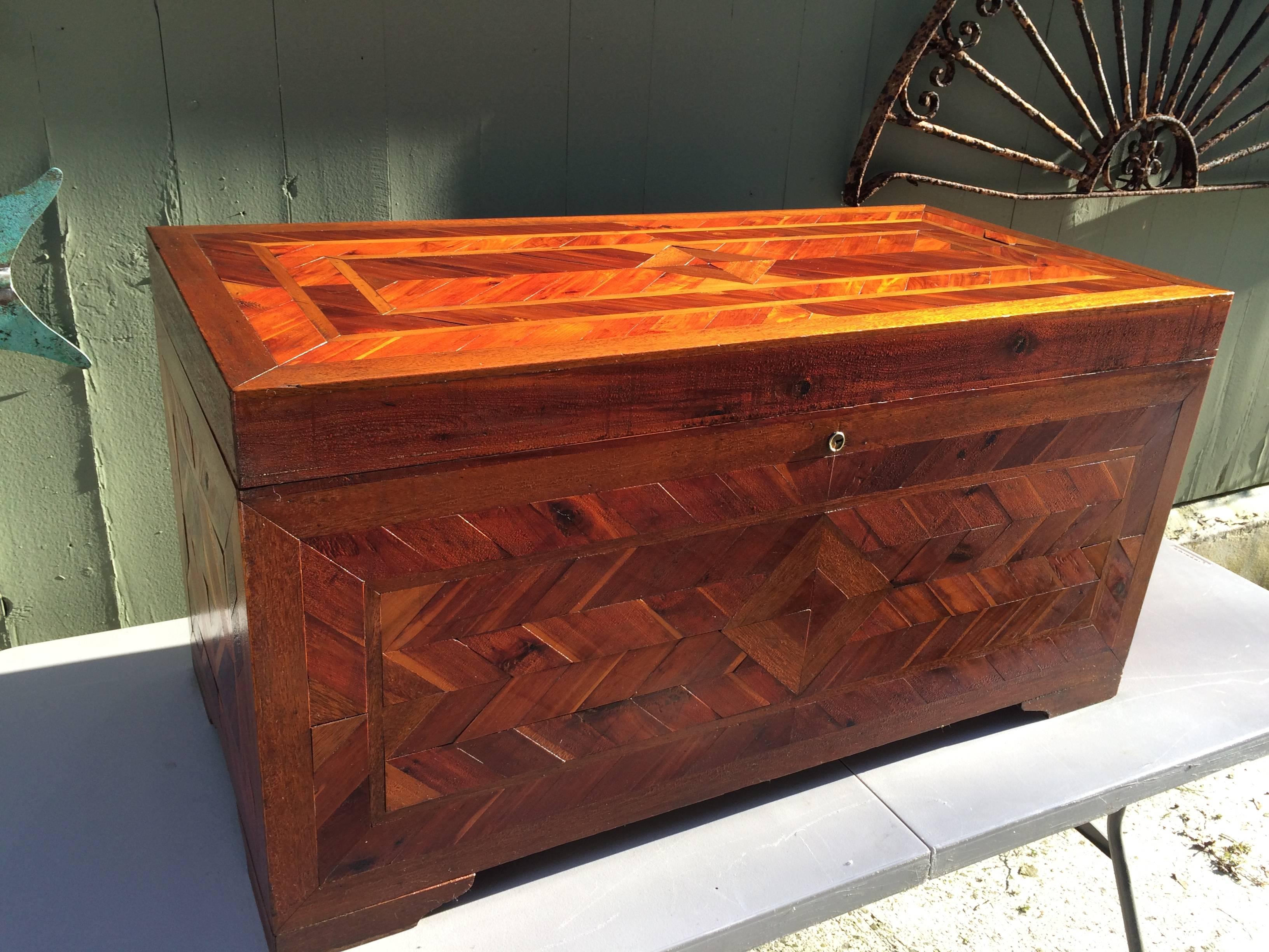 Huge Primitive Inlaid Parquetry Cedar Lined Blanket Chest. Detailed Mosaic woodwork makes up this one of a kind folk art piece. Perfect for storing blankets at the foot of your bed or sweaters in a dressing room. Feel free to ask for more photos.