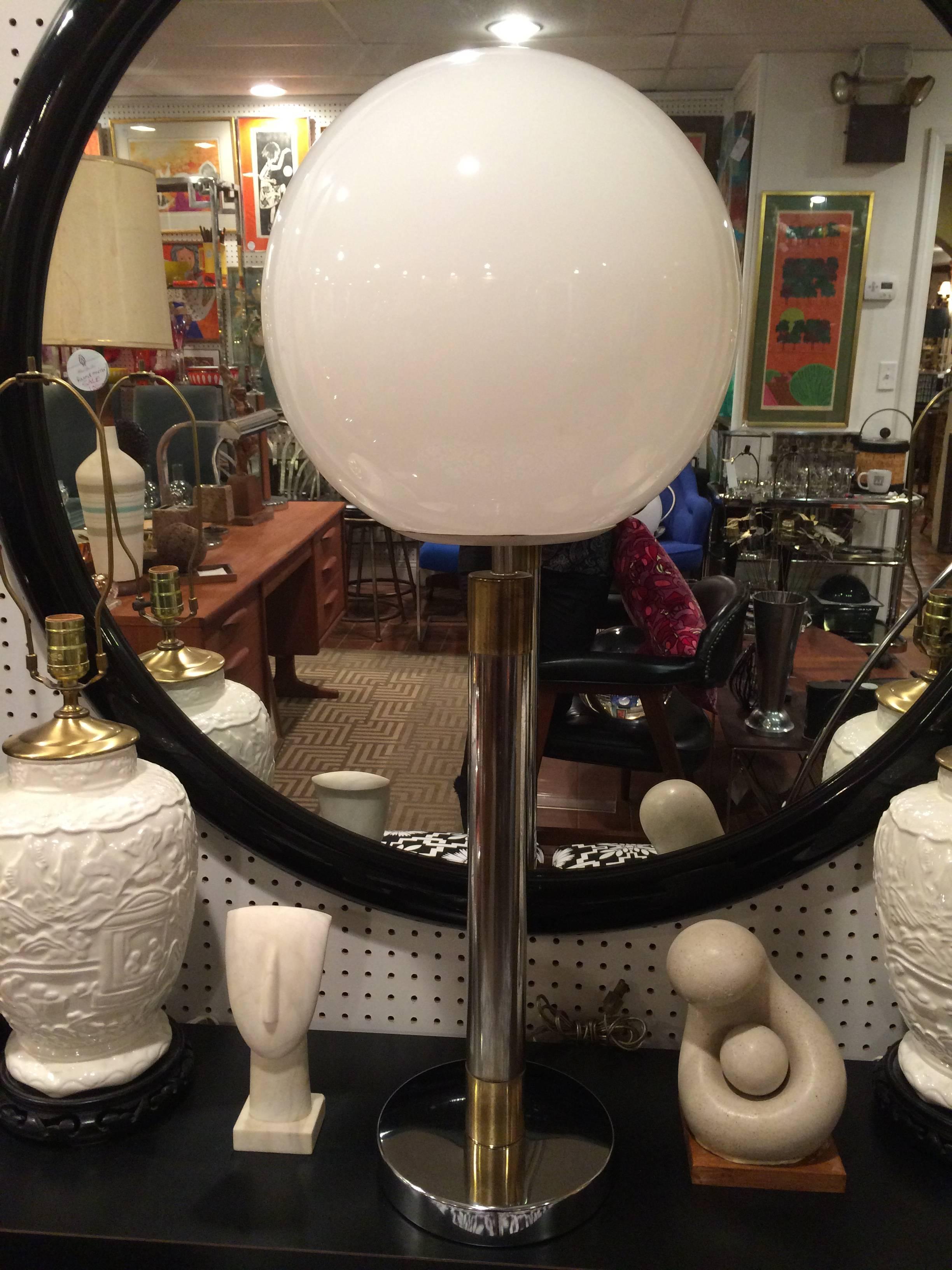 Robert Sonneman Style lollipop table lamp. Classic lines make up this chrome beauty with banded brass accents. Round sputnik shaped glass globe tops with cylindrical base. Base is 9