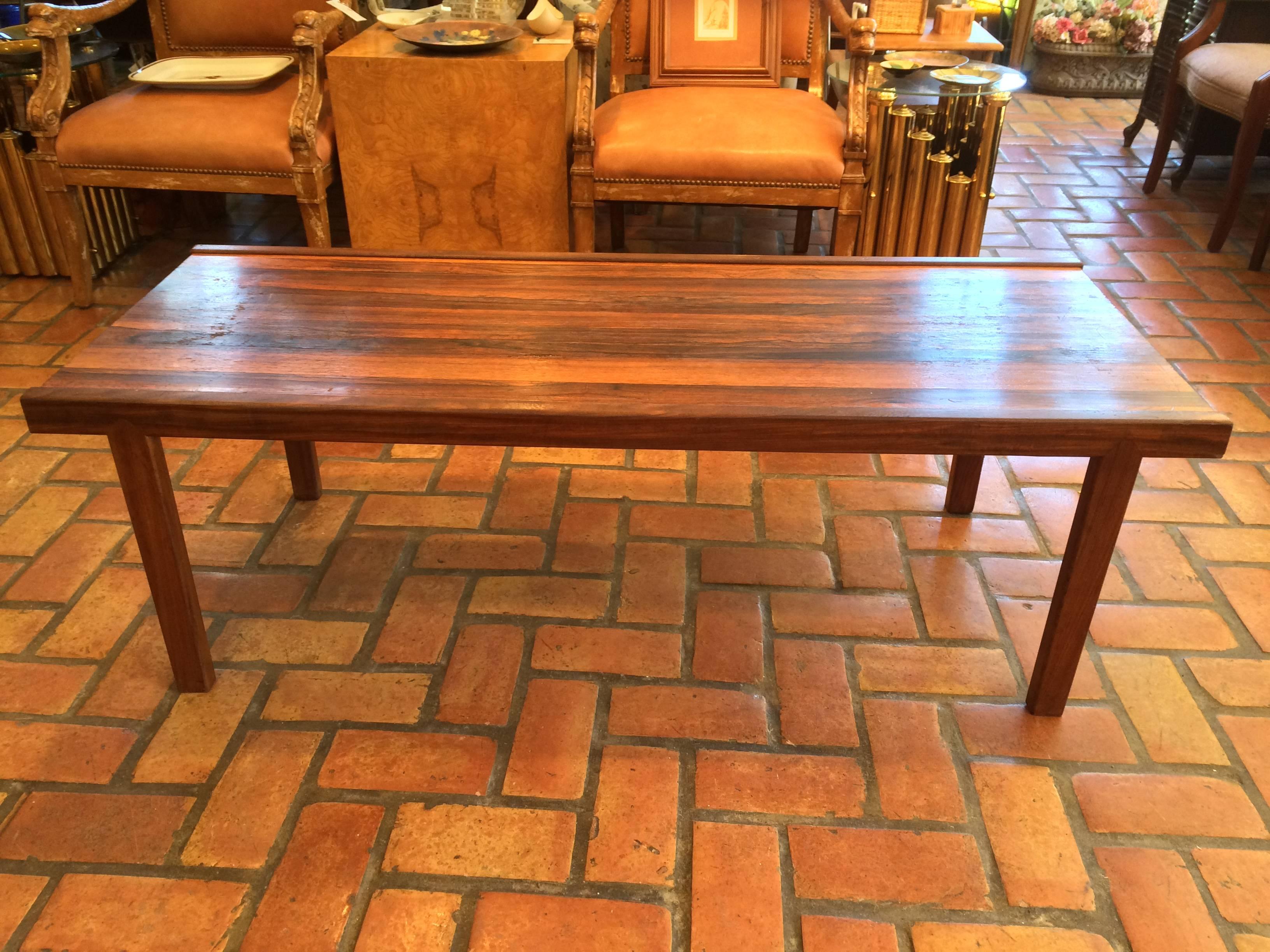 Signed A.H. McIntosh Mid-Century rosewood coffee table.  Classic parsons shape with simple minimalist lines. Beautiful rosewood grain makes up this classic table. Perfect size for most sofas. Rare,exotic wood  that is now considered extinct. Buy a