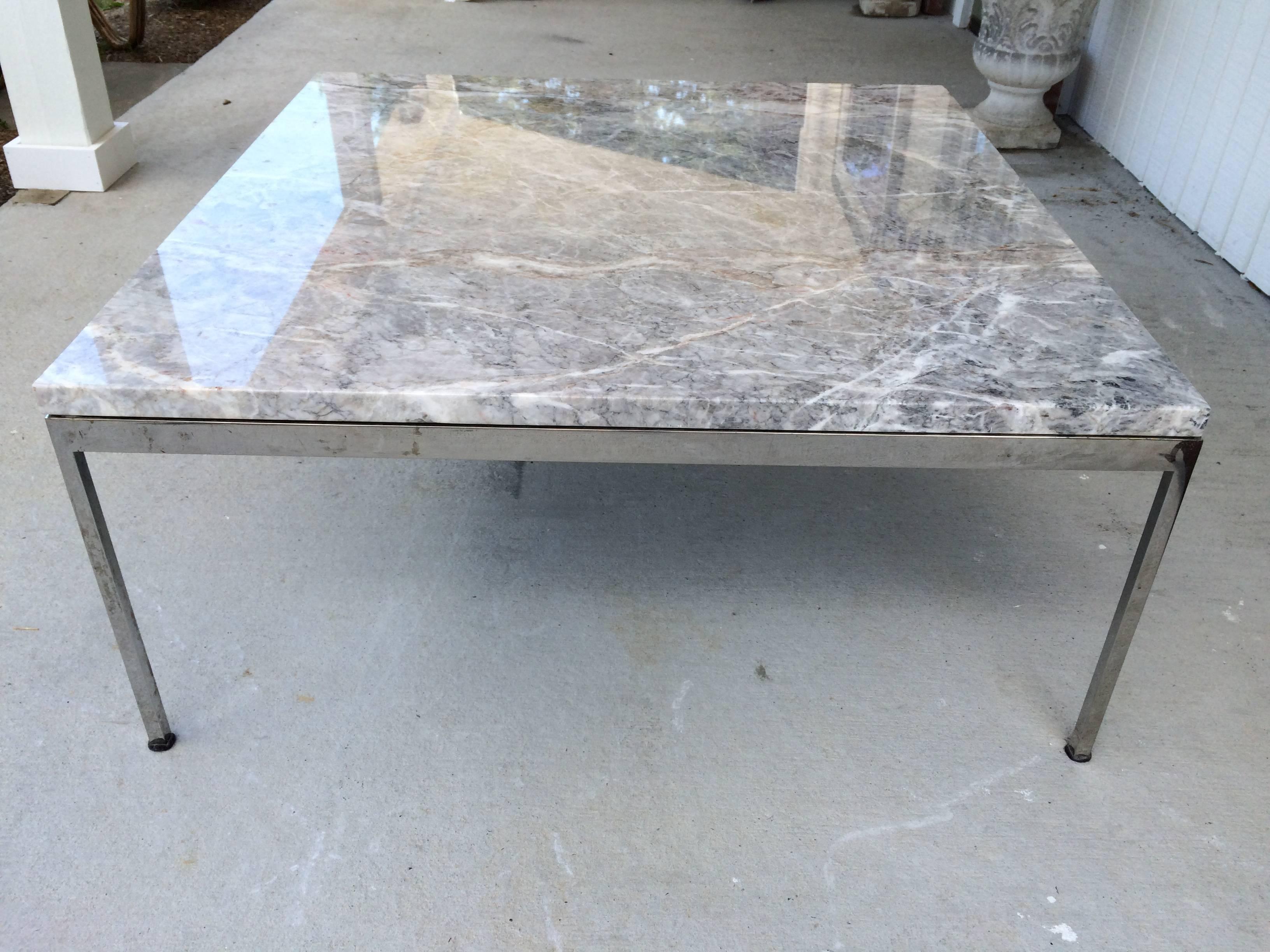 Sleek chrome and marble coffee table. This elegant table will go with any style decor from Minimalist to Hollywood glamour to Mid-Century Modern. Timeless. No pitting to chrome. Just reflections on ground.