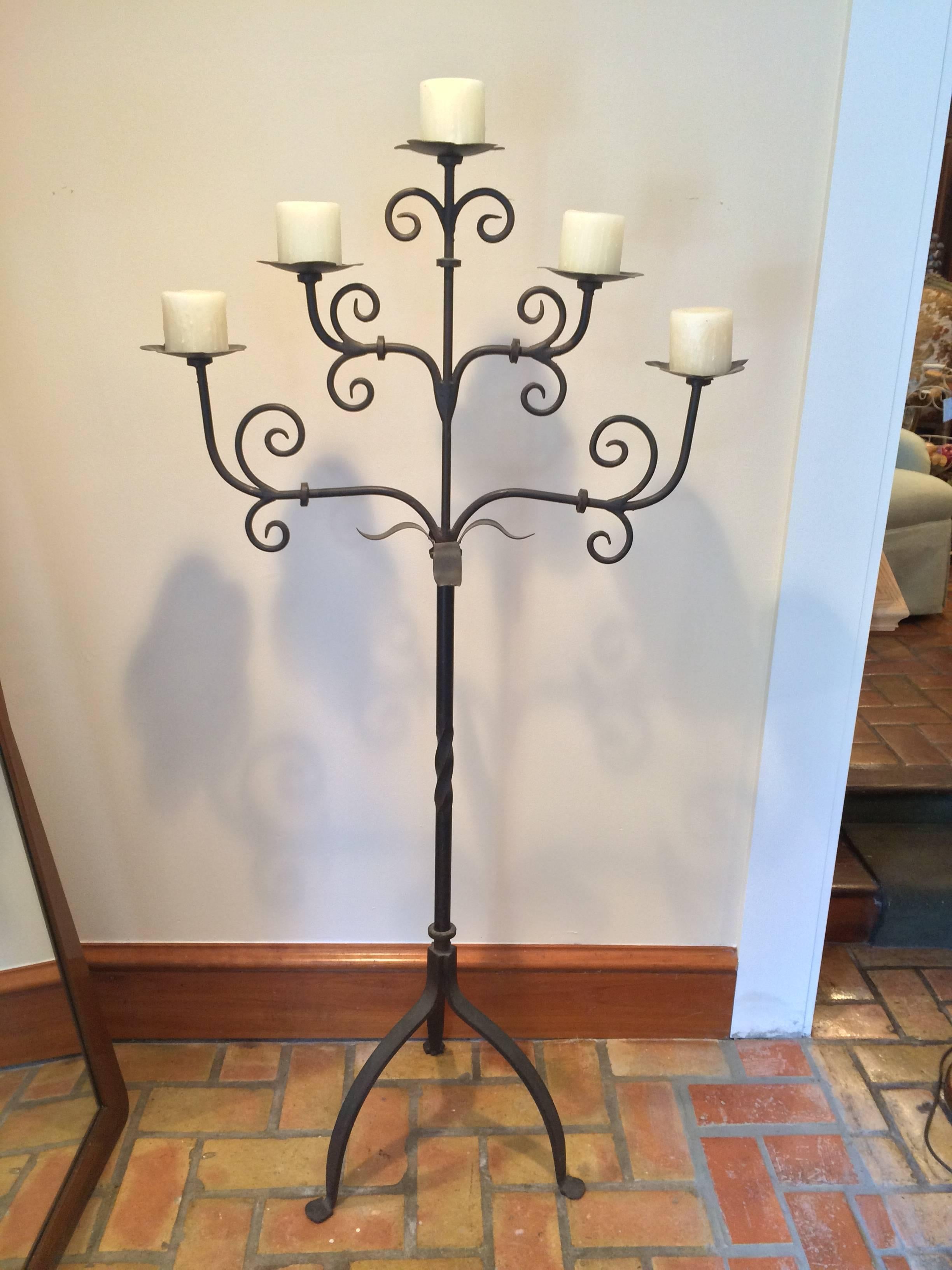 Handmade wrought iron candelabra. We believe this to be a piece by Arte De Mexico but cannot find a stamp or signature. Holds five large candles and would add romance and ambiance to any patio or bedroom. Large and heavy . Very sturdy balanced