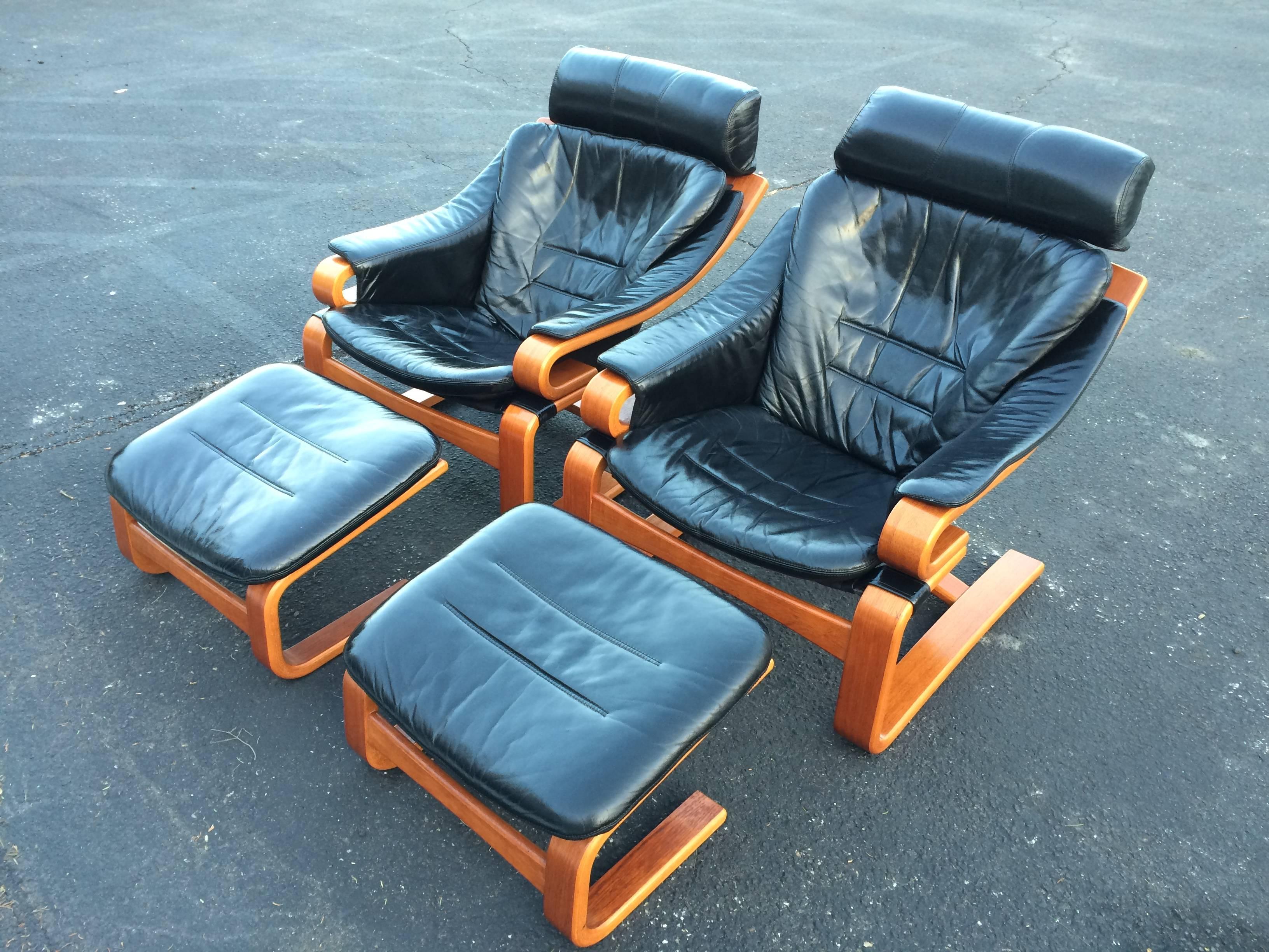 Pair of Danish modern leather lounge chairs with ottomans by Skipper Mobler. Model name 