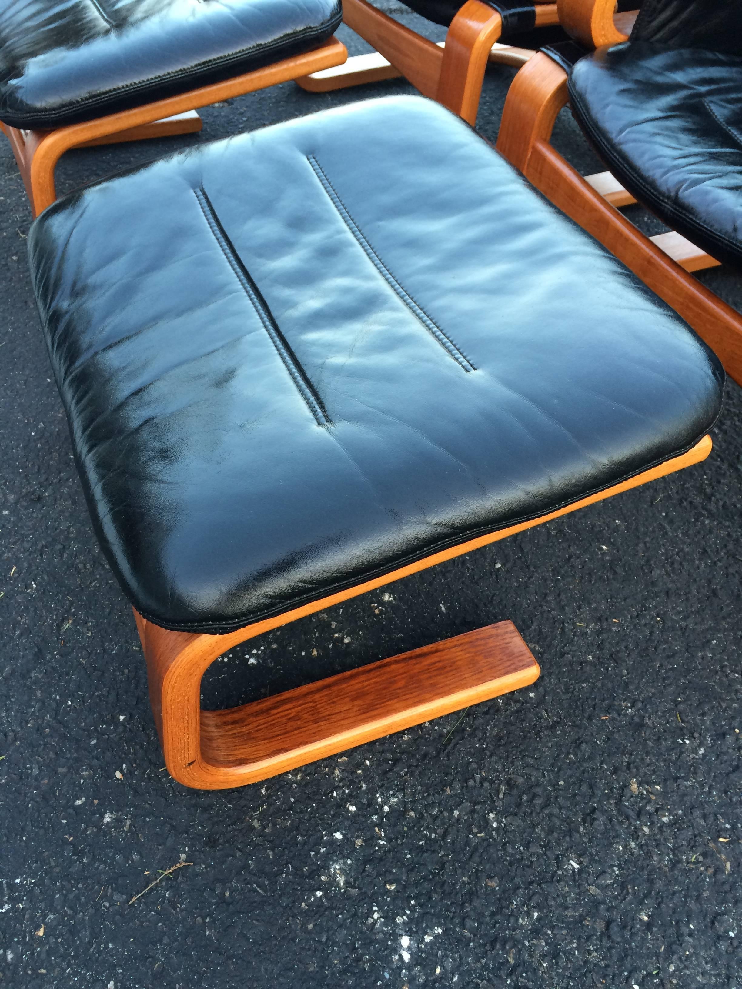 Pair of Danish Modern Leather Lounge Chairs with Ottomans 1