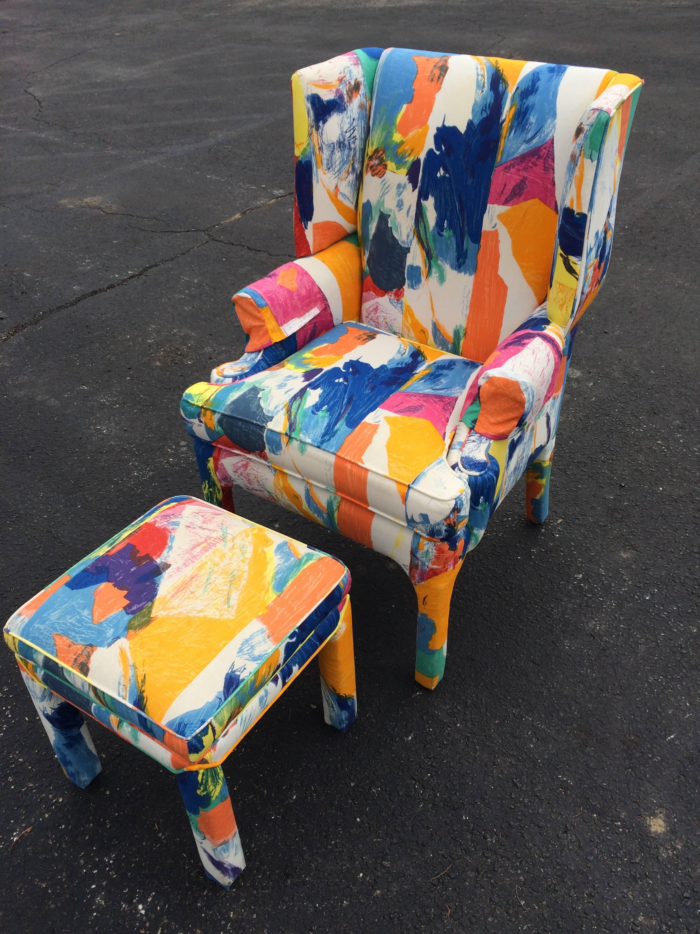 Mid-Century wing back chair and Ottoman by Century. Fabulous splash of colored fabric covers this solid, heavy chair. It comes with a matching Parsons style ottoman. 
The upholstery has wear at corners and on one arm and edges of piping.
It could