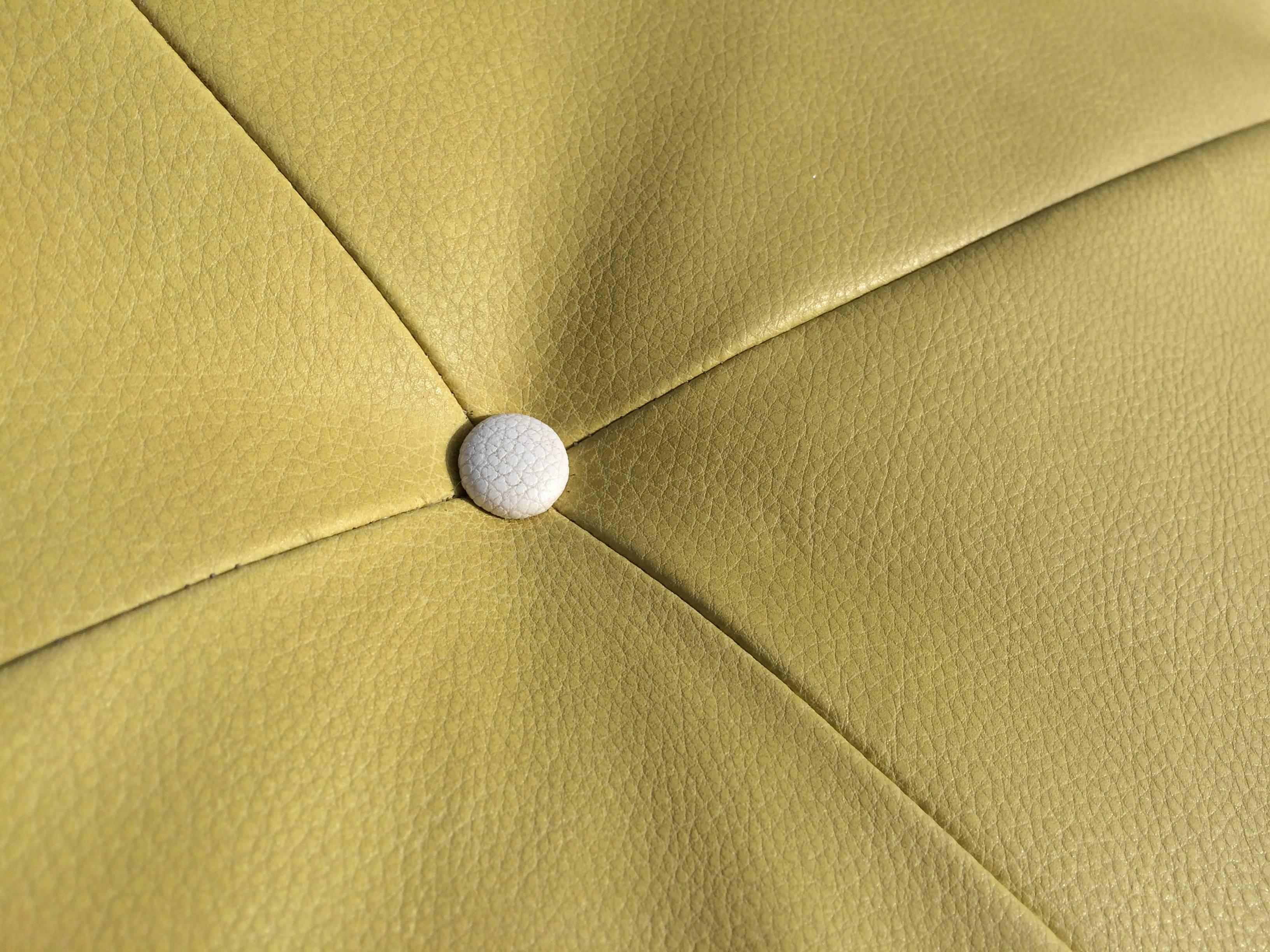 Late 20th Century Tufted Round Yellow Ottoman on Brass Castors