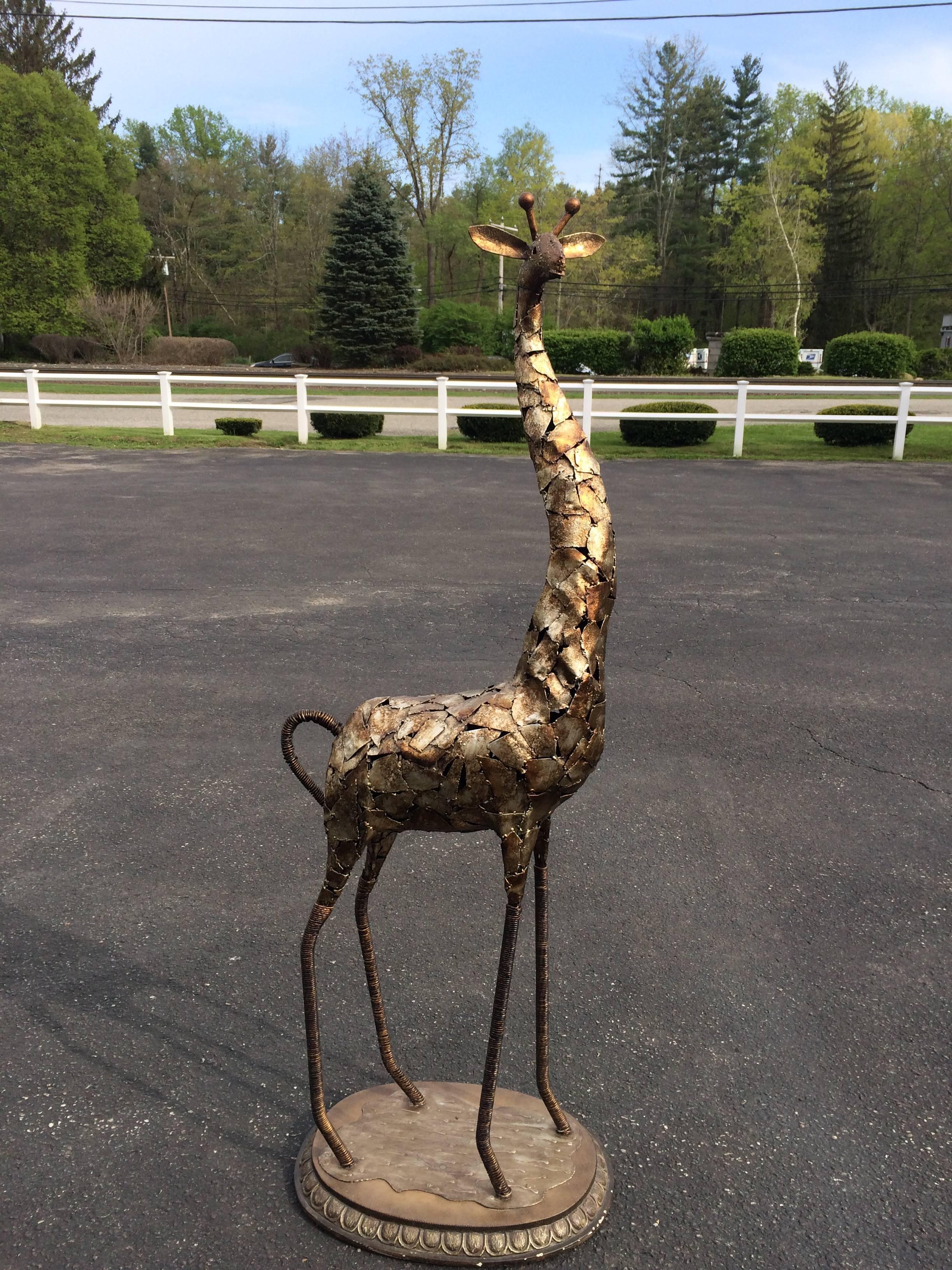 Brutalist metal giraffe statue. Whimsical fun sculpture for a kid's room or an indoor garden or patio. Torch cut and welded pieces put together like a puzzle. Stable wide oval base. Very sturdy.
