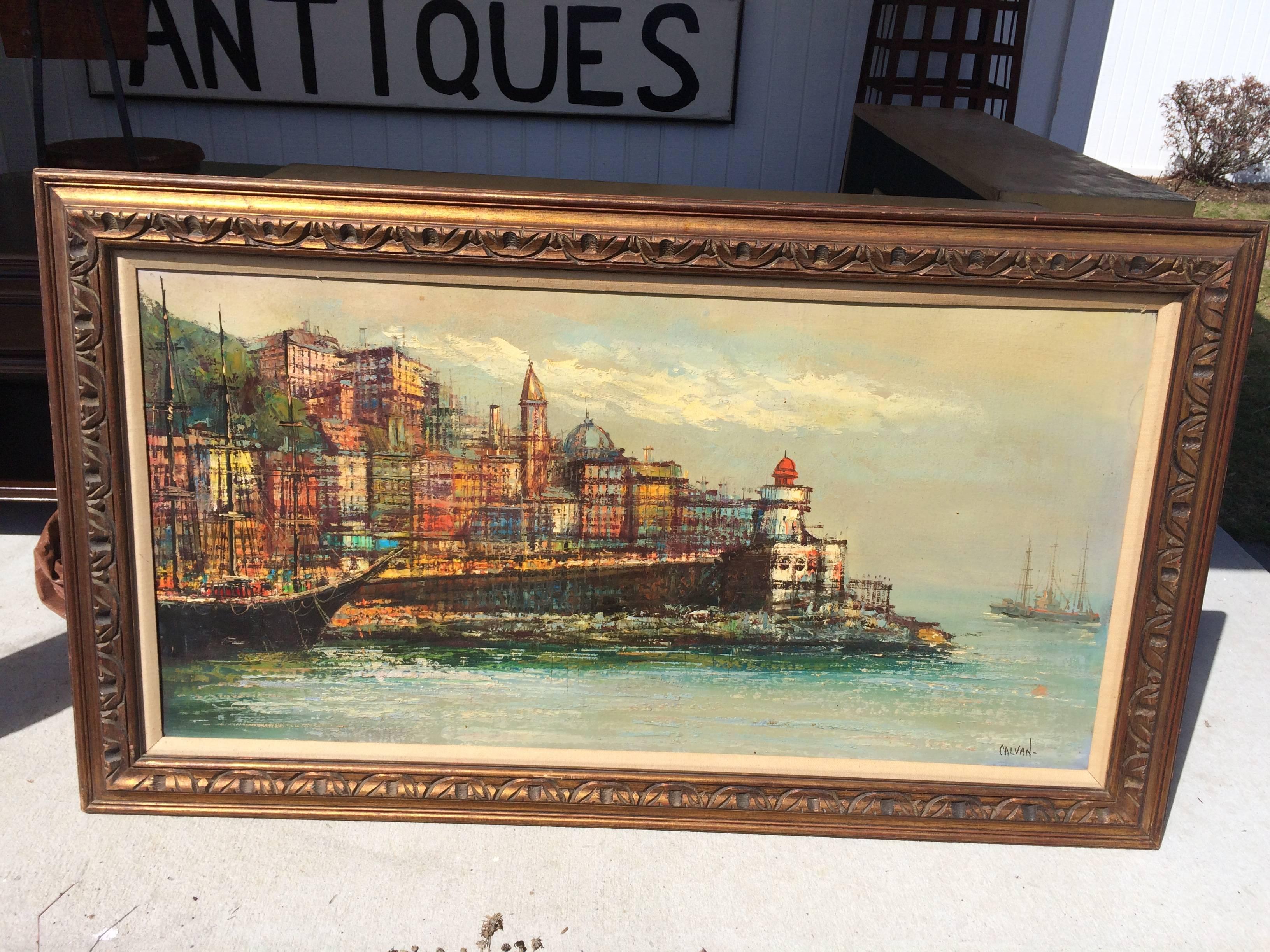 Large Modernist Mid-Century painting of a port. Impasto style with bright layered colors. Oil on canvas. Original hand-carved solid wooden frame. Can be re-framed to update the style.
This piece of art would look great above a low wide Mid-Century