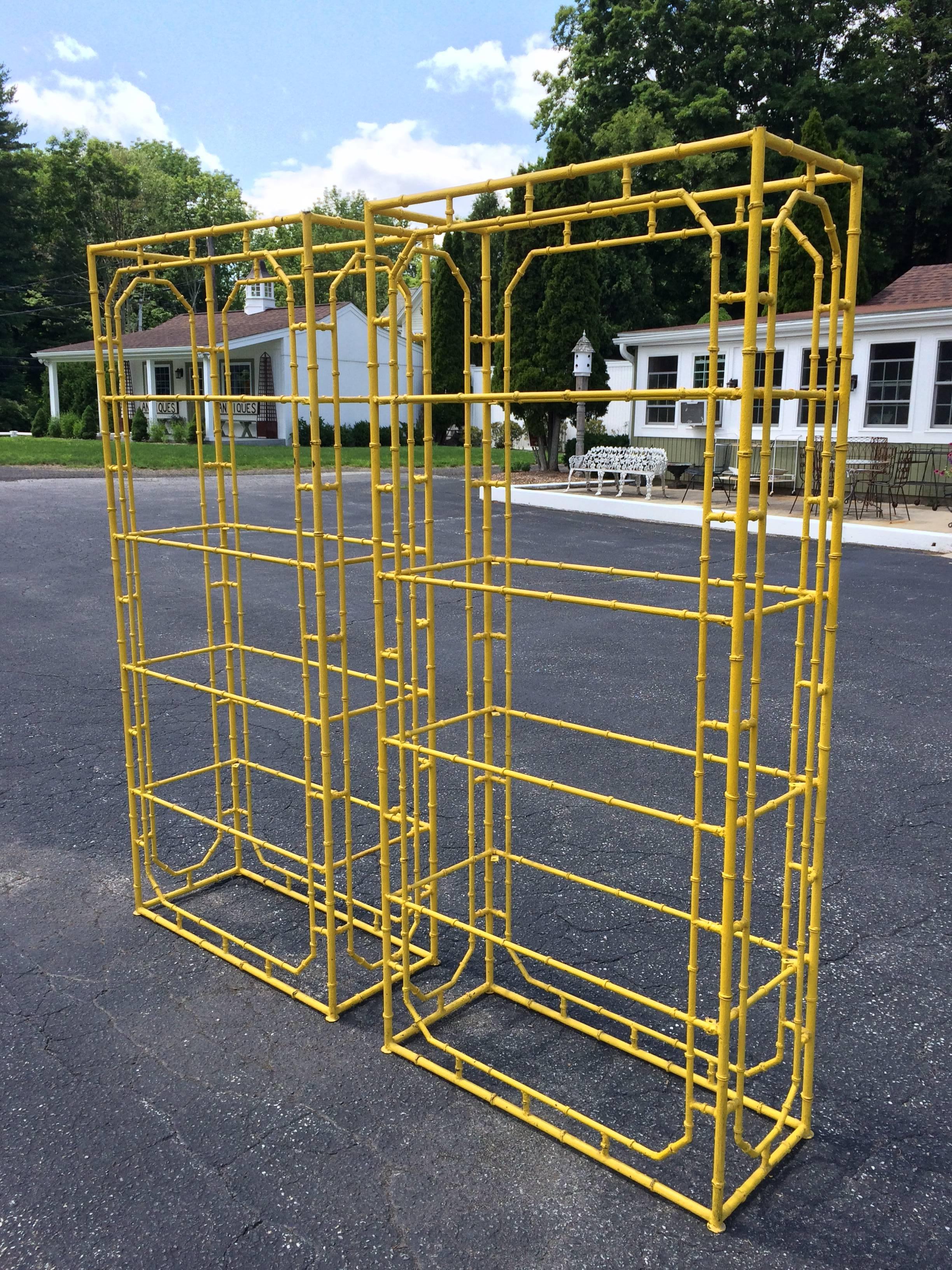 Pair of Chinese Chippendale faux bamboo iron etageres. Glass shelves included but not photographed. Please request more photos. This bright yellow painted pair, can be changed to any color desired. Four large glass shelves allow for ample storage